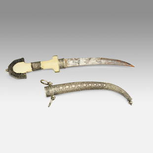 Antique Moroccan Islamic Jambiya Koummya Dagger Knife w/Silver Scabbard: Ca. 19thC. Approx. total L: 15". Fine chased silver scabbard, handle and mounts all in very good original condition with no breaks or repairs. Handle shows dark age cracks with one minor chip. Steel