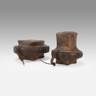 Two Bontoc Lidded Carry Baskets Igorot Woven Tribal Rice Containers Philippines: Ca. early 20thC. Two Lidded Baskets. Taller basket measures approx. H: 9" W: 7 3/4". Shorter basket measures approx. H: 6" W: 10 1/2". Ex-Nooter coll.