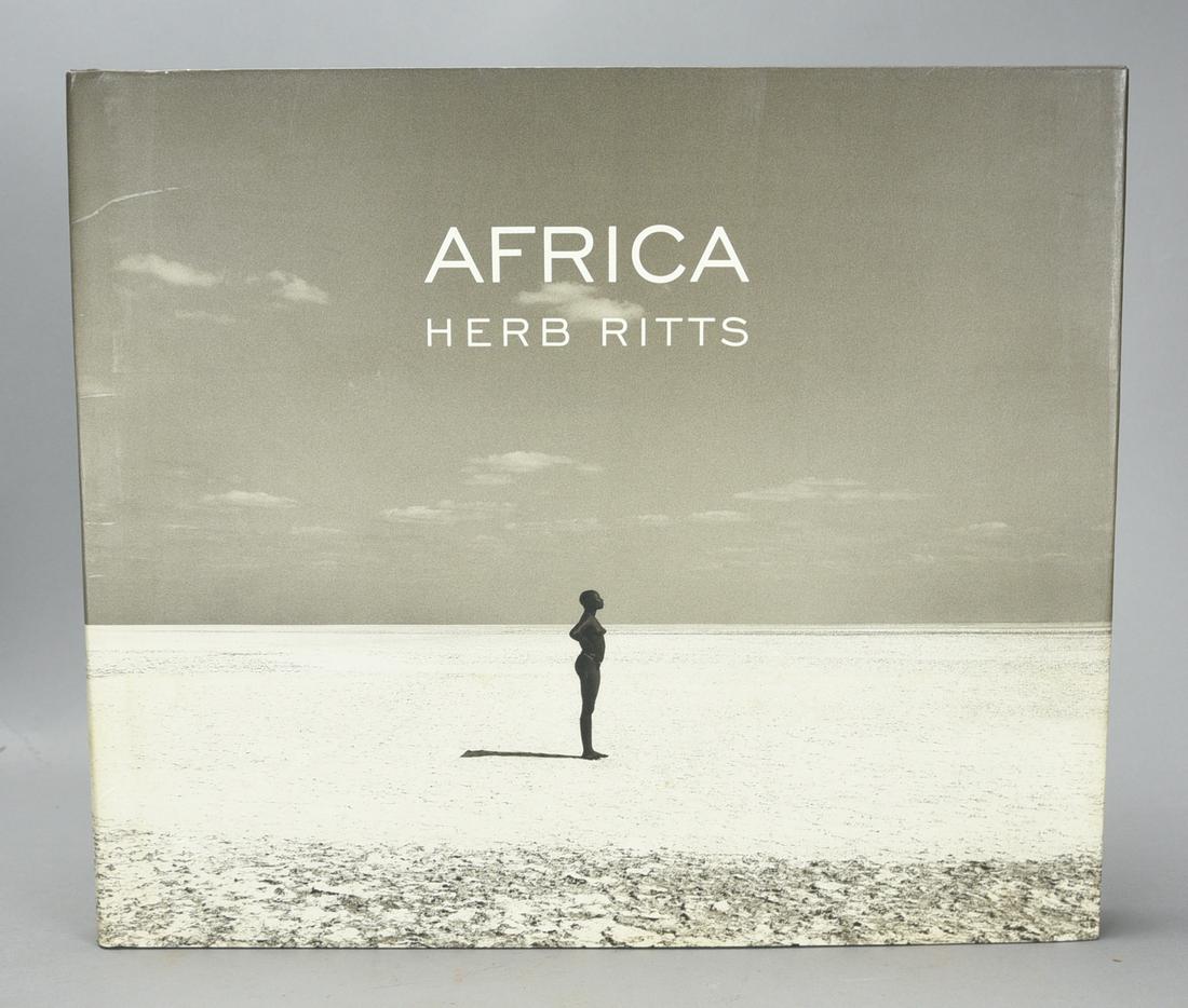 "Africa" by Herb Ritts. Bullfinch, 1994: "Africa" by Herb Ritts. Bullfinch, 1994. Near fine condition with the gutter being occasionally exposed. White pages. Loose binding. The book features a collection of black-and-white photographs of Af