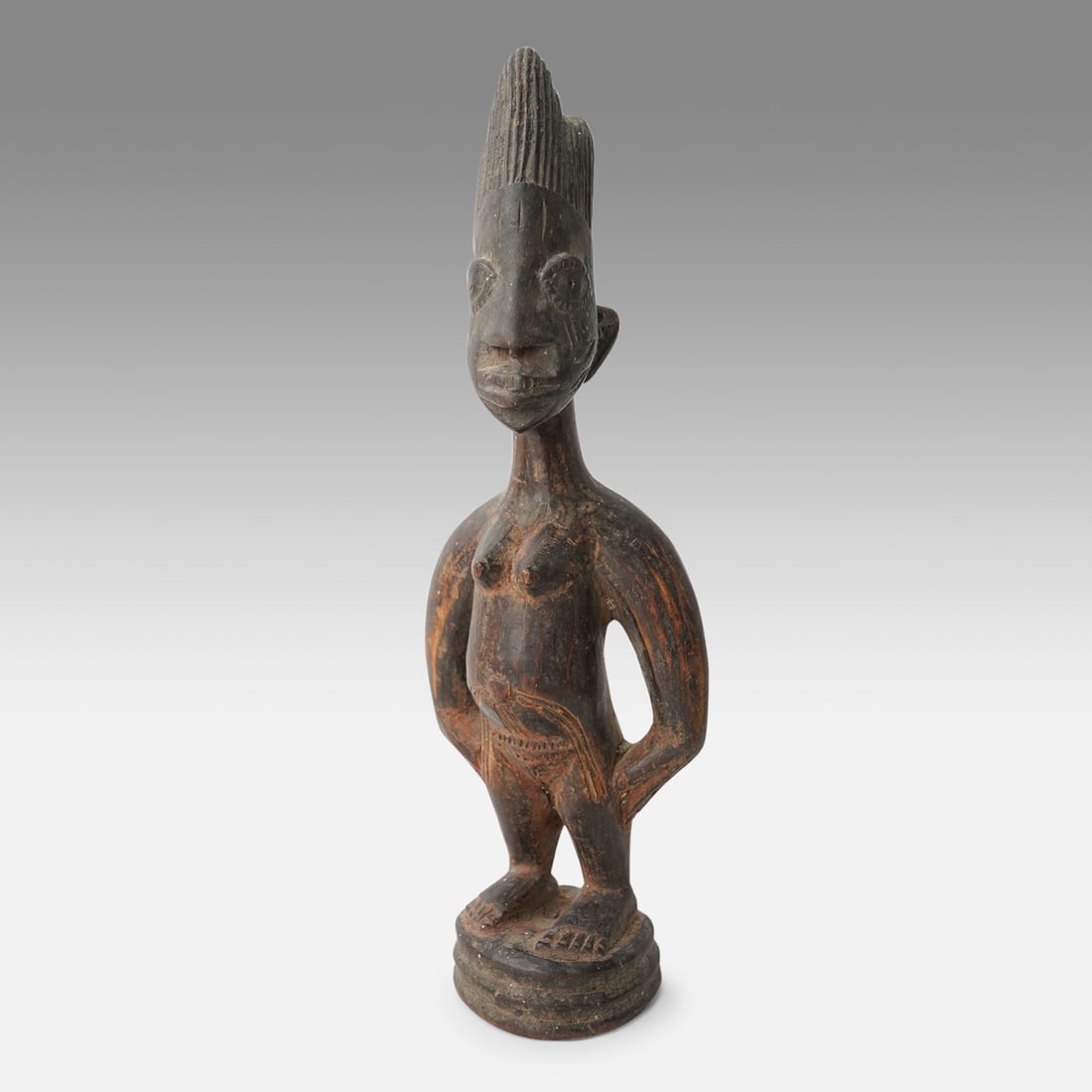 Yoruba Ibeji Twin Figure Oyo Style African Tribal Carved Wood Female Statue: Ca. mid 20thC. Very good with age-appropriate surface patina wear with spots of minute wood loss. Yoruba female Ibeji/twin figure; Oyo style; tall crested coiffure. Ex-Nooter coll.