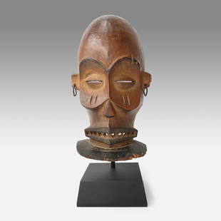 A Fine Chokwe Male Facemask Carved Wood Mask Cihongo African Tribal, Angola: Ca. early 20thC. Male dance mask called tshihong, used in festivals to summon the spirits of strength, and symbolizes wealth and power, the mask also confers judiciary powers to the wearer. Very good