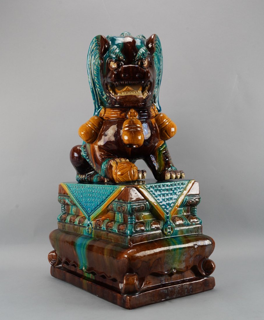 Antique Chinese 24" Multi-Colored Turquoise Sancai Pottery Fu Dog w/Stand Temple Guardian: Ca. mid 19th to first quarter 20thC. Shows very minor chips and overall glaze crazing. This is a large piece, the Foo dog itself measures approx. H: 14".