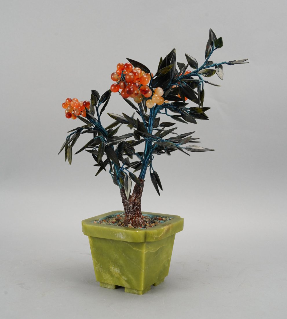 Fine 20thC Chinese Carved Jade & Carnelian Hardstone Pyracantha Firethorn Bush: Ca. mid 20thC. Very good original condition with no major chips, cracks or repairs. The green soapstone base by itself measures approx. H: 3" W: 4" x 4". Total height 12". This example seems to be a b
