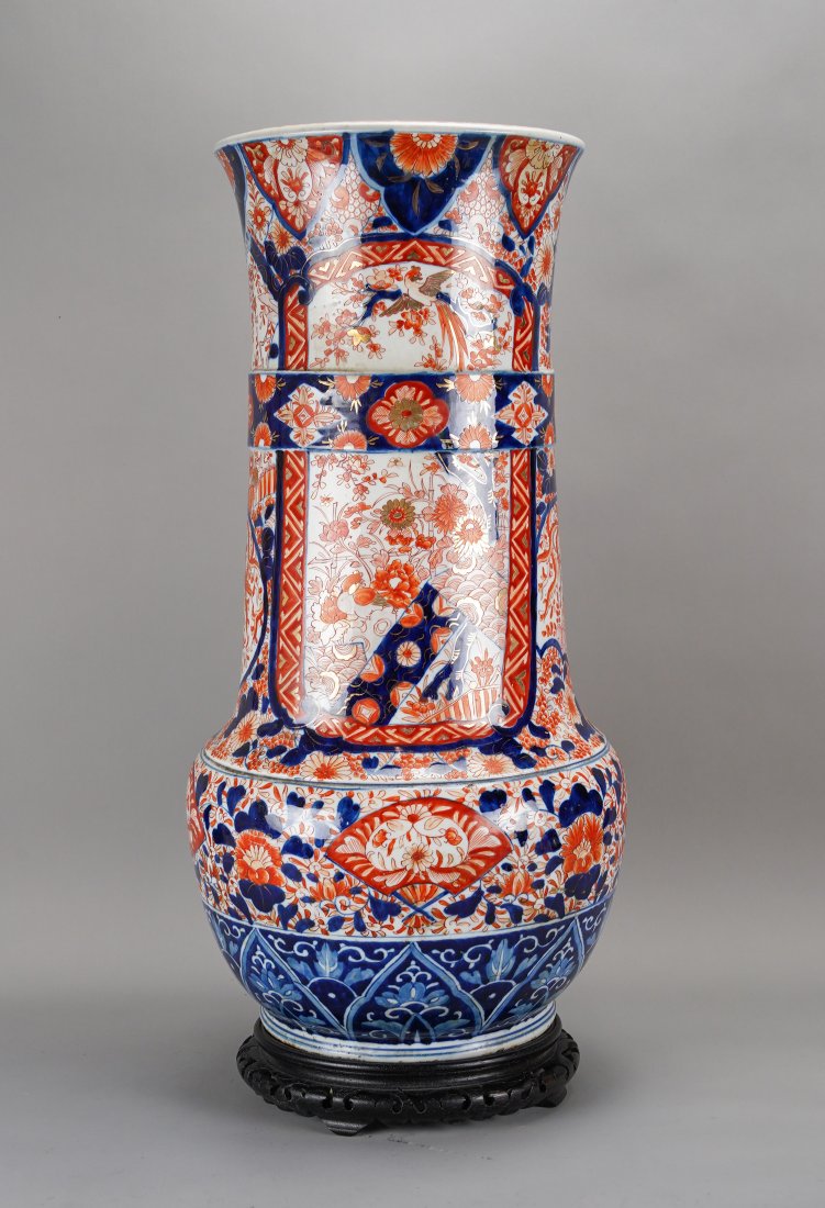 Large Antique 19thC Japanese Imari Porcelain Floor Vase Jardiniere: Ca. mid 19thC. Very good with no chips, cracks or repairs. The wood base stand that is shown is included, however, its a touch smaller than the urn base. Very large 25" Japanese Imari porcelain floor 
