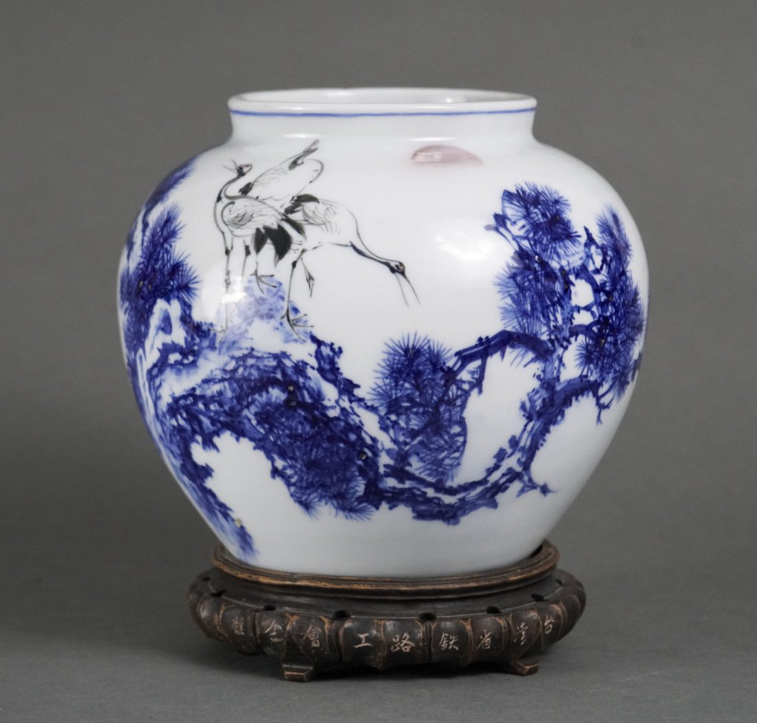 Fine and Large Japanese Signed Blue and White Jardiniere Bowl w/Cranes: 20thC. Very good with one nick at the base rim-enlarge pictures to see this, and the stamped makers mark. The rim measures approx. 5 1/4" diameter. 8 1/4" H (without wood stand) x 9" Diameter
