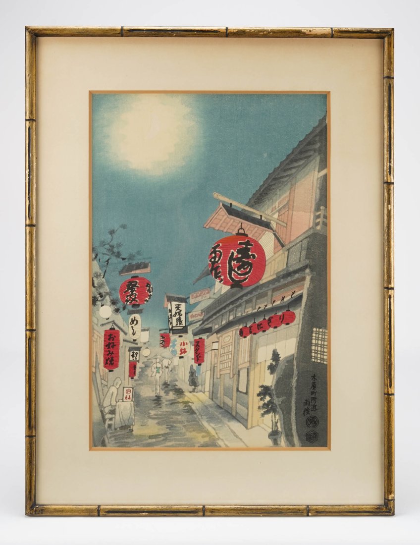 Framed Japanese Woodblock Print by Eiichi Kotozuka NIGHT SCENE KIYAMACHI STREET: Japanese woodblock print by Eiichi Kotozuka (1906-1979), depicting a night scene on Kiyamachi street with pedestrians crossing by storefronts under bright red lanterns. Framed and matted under glass, 