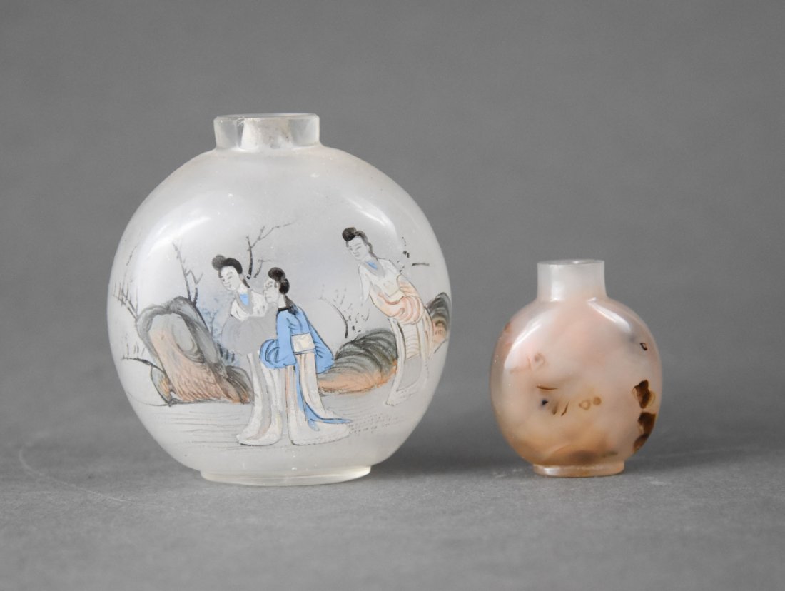 Two Chinese Snuff Bottles Carved Quartz Stone and Reverse Painted Glass: Ca. 19th/20thC. Both very good with no cracks or repairs. The ponly chip is on the top rim of the glass bottle. Neither bottle retains the top. The smaller bottle is the older of the two, and appears 