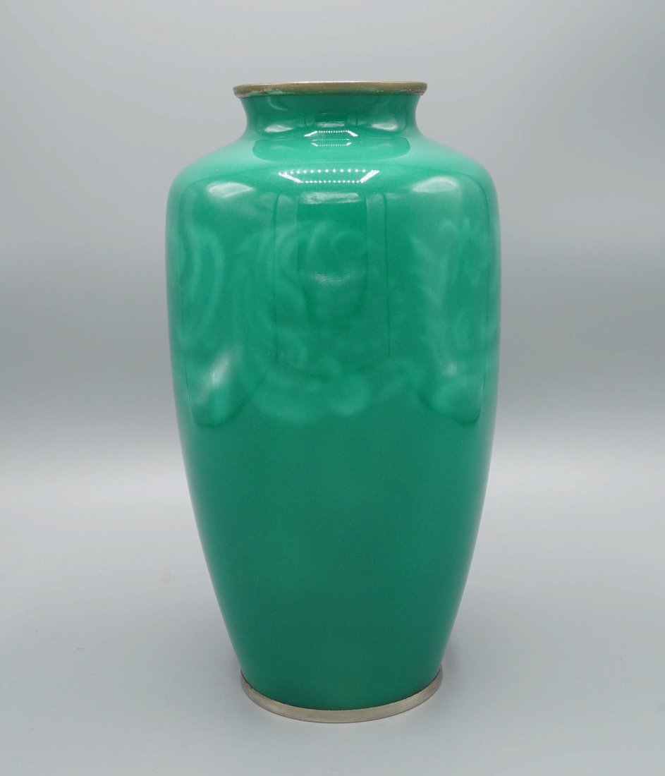 Fine Japanese Ando Jubei Green Wireless Cloisonne Silver Rimmed Vase: Ca. early 20thC. Japanese cloisonne enameled vase with silver/silver plate rims decorated with light green wireless flower and foliate (possibly chrysanthemum) motifs on a jade green ground. Unsigned.