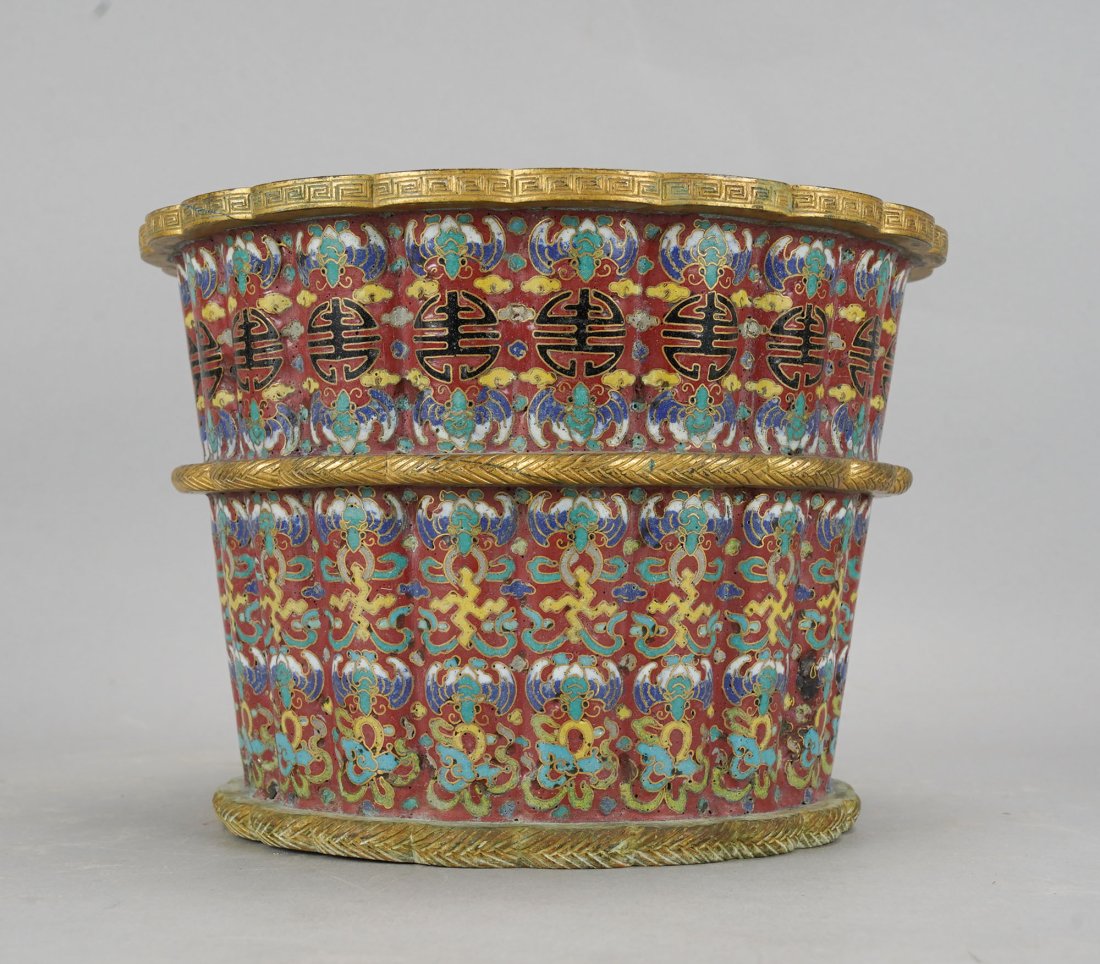 Antique Chinese Cloisonne and Bronze Lobed Planter Vase: A Chinese cloisonne on bronze scalloped planter with bat, Greek key, and other motifs, presumably Qing Dynasty, ca. 19th century. Measures approx. 6 1/16" H x 8 1/4" W x 8 1/4" D.