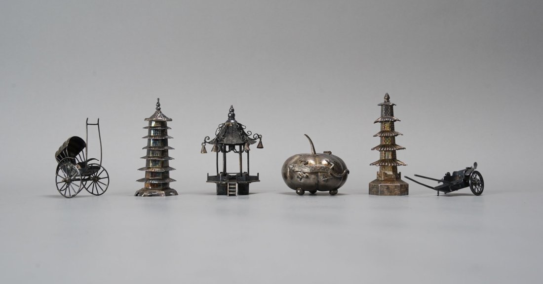 Six Assorted Chinese Export Silver Articles: Ca. late 19th to early 20thC. Three pagodas, one lidded mustard pot, and two rickshaws, one rickshaw is missing a wheel, one pagoda missing a tiny bell. Otherwise all else fine with no breaks or repai