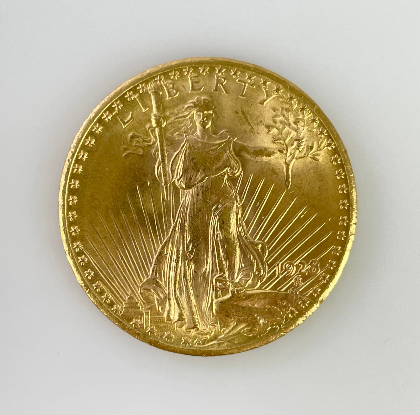 US 1928 Saint Gaudens Gold $20 33.43g .900 Gold: Struck in 33.43g of .900 gold for an AGW of 30.087g. All shipping will be through USPS Registered Mail, we do not combine shipping.