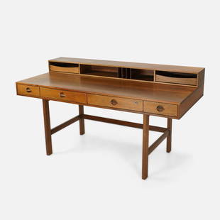 Peter Lovig Nielsen for Dansk Danish Modern Flip Top Teak Writing Desk: Ca. 1960s. Flip top teak writing desk by Peter Lovig Nielsen for Dansk, this desk is often falsely attributed to Jens Quistgaard. Please note the variability on the color of this desk in photos, the c