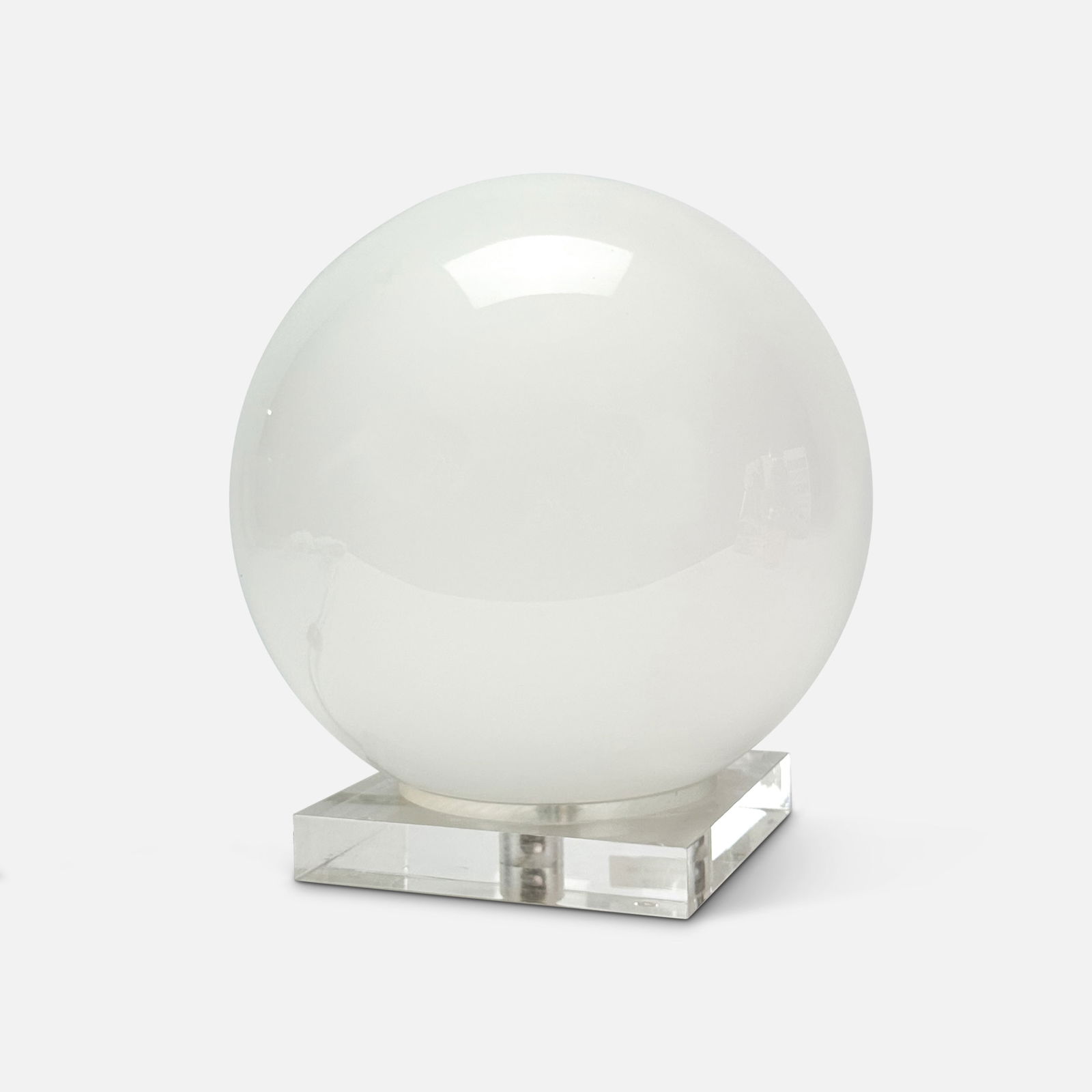 White Glass Sphere MCM Ball Lamp on Clear Lucite Stand: Ca. last quarter 20thC. Good with no chips, cracks or repairs. We suggest a qualified technician look the wiring over before use. Ball shade loosely rests on stand.