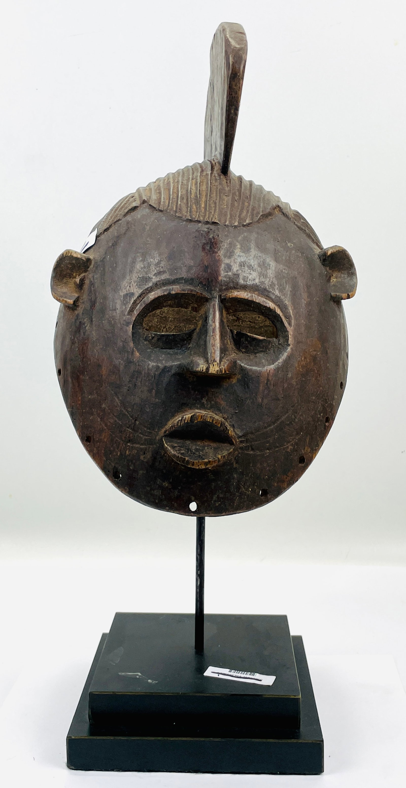 Hemba Tribal Carved Wood Janus Twin Helmet African Mask: Ca. second half 20thC. Good with age-appropriate cracks as shown. Measurements include the stand. This item(s) is used, and will show multiple areas of age appropriate wear and surface losses. Please 