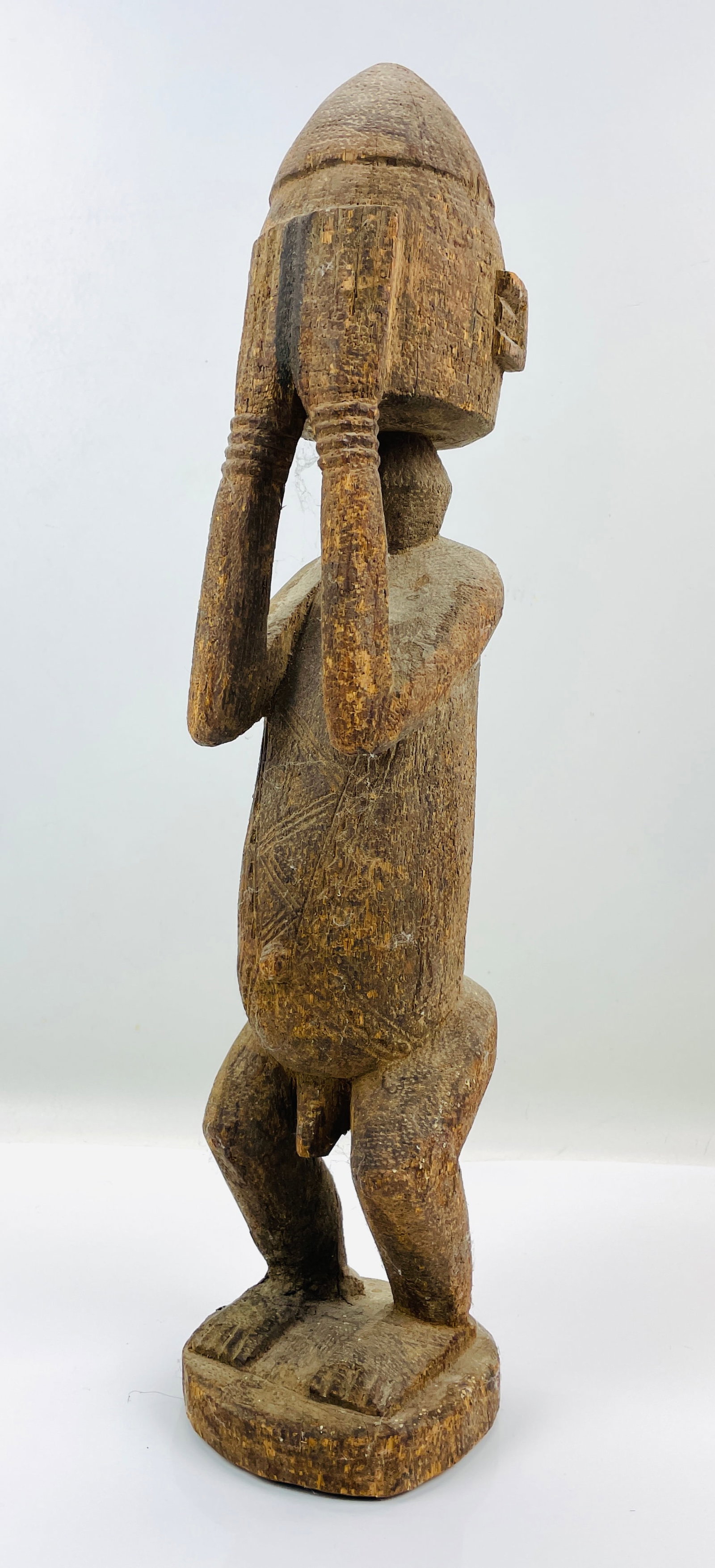 Dogon Kambari Carved Wood African Figurine Hands Over Face Mali: Ca. last half 20thC. Very good with original patina and only minor surface/wood losses. This item(s) is used, and will show multiple areas of age appropriate wear and surface losses. Please view all p