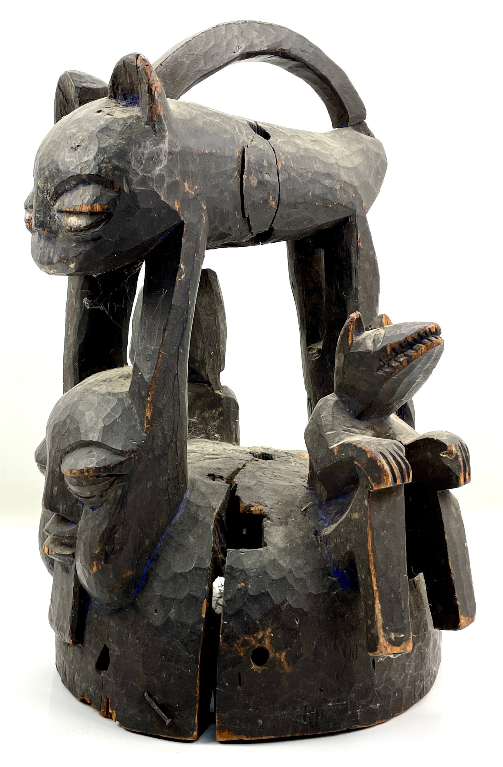 Yoruba Carved Wood African Tribal Helmet Mask w/3D Animal Forms: Ca. last half 20thC. Shows wear and age cracks, along with minor wood loss, including surface patina. This item(s) is used, and will show multiple areas of age appropriate wear and surface losses. Ple