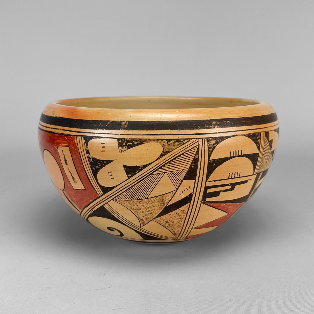 Ruth Paymella Hopi Pewa Polychrome Pottery Bowl: Ca. mid 20thC. Hopi Pewa geometric Native American pottery bowl by artisan Ruth Paymella (1904-1989). In good overall condition, with polychrome fading, and no chips, cracks, or repairs.