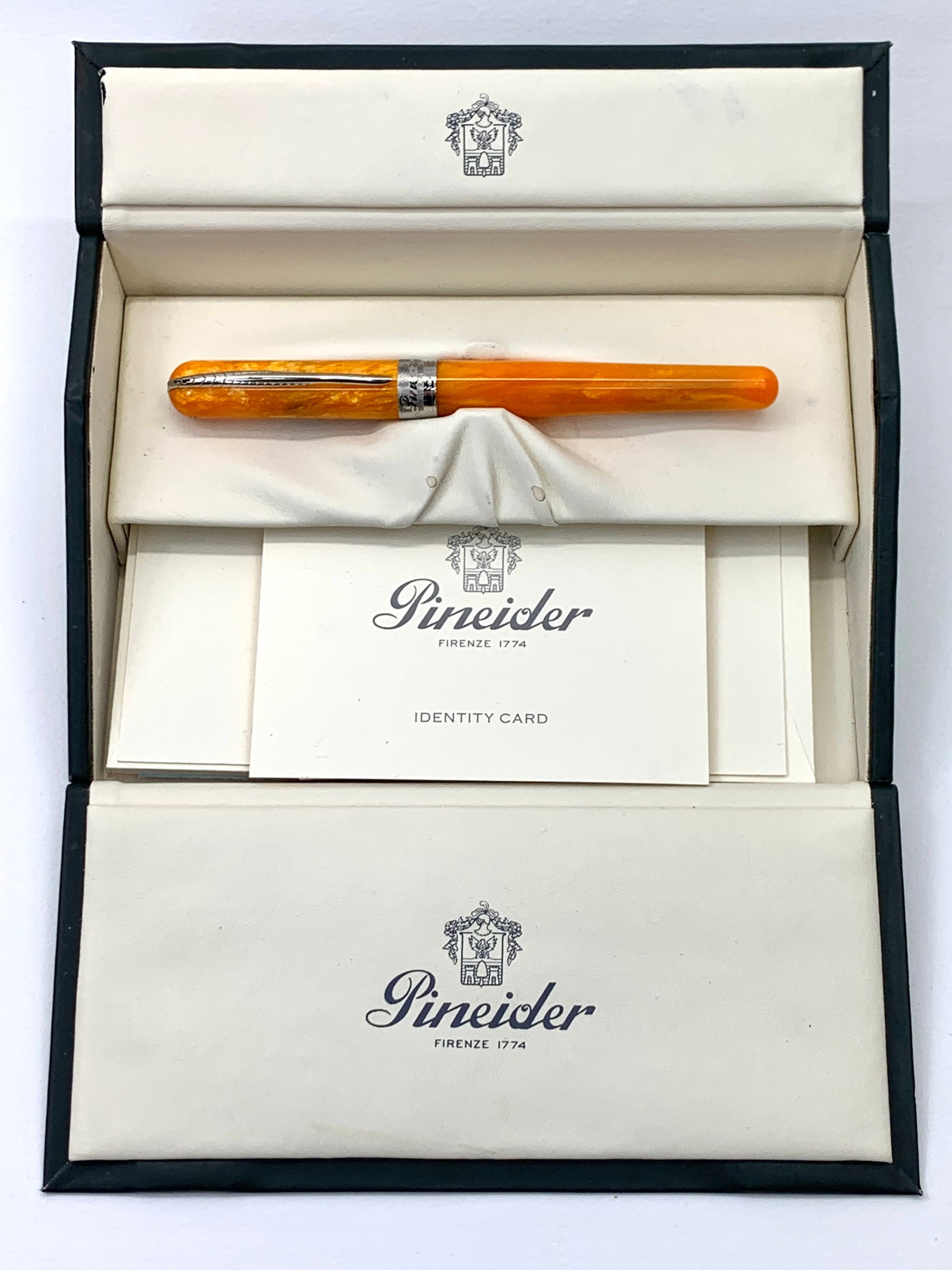 Pineider Italy Orange and Chrome Fountain Pen w/Box: Lightly used. This one remains in excellent original condition with a magnetic cap enclosure system. Approximately 5 9/16 inches closed. Boxed with paperwork.