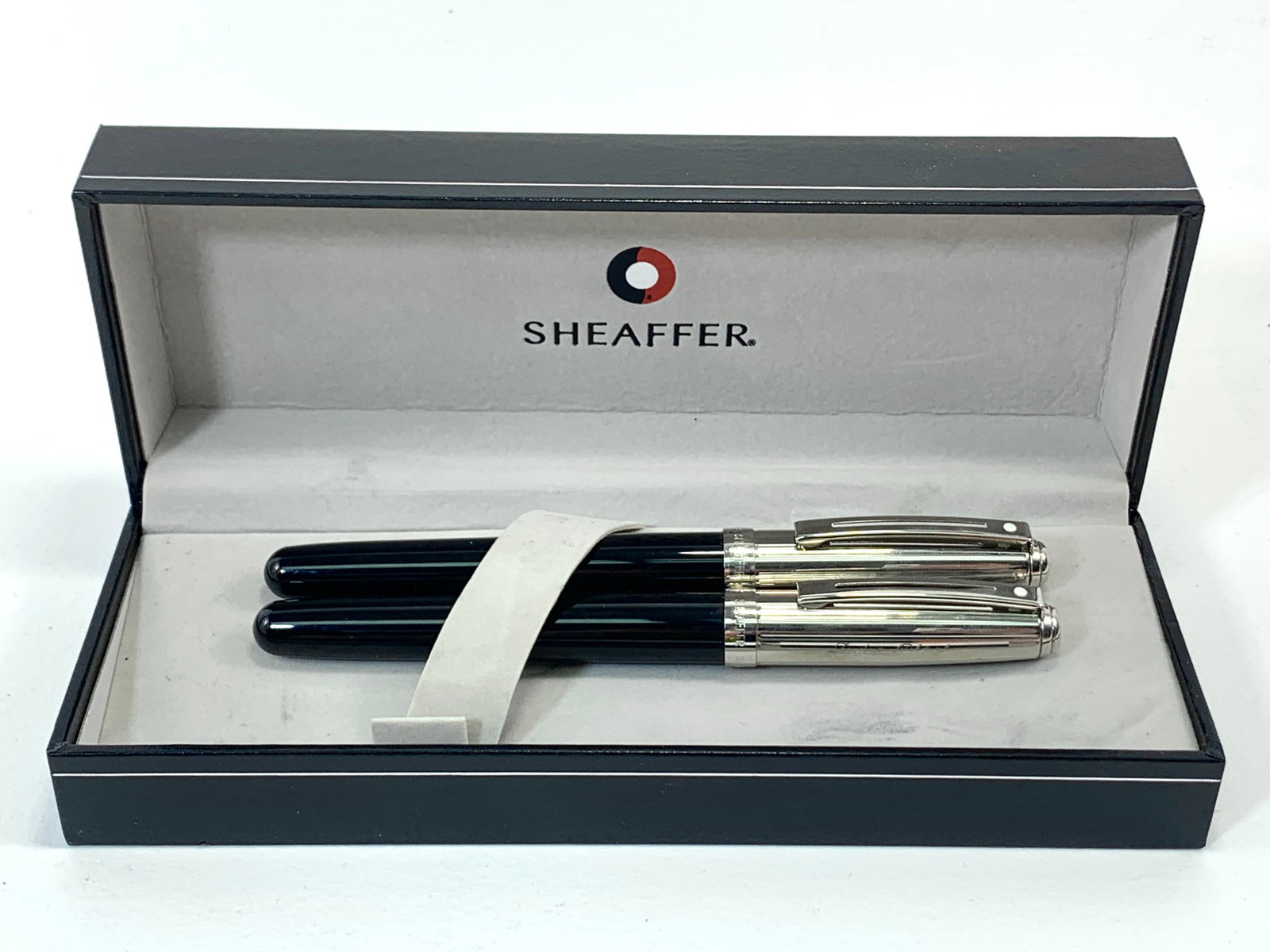 Sheaffer White Dot Black and Chrome Fountain and Ballpoint Pen Set w/Box w/Inscription: Excellent single use condition, with no defects. Inscribed name on the chrome caps. Approx. 5 1/4". Glossy finish throughout. Box may show moderate shelf wear, and may include ink stains. Please enlar