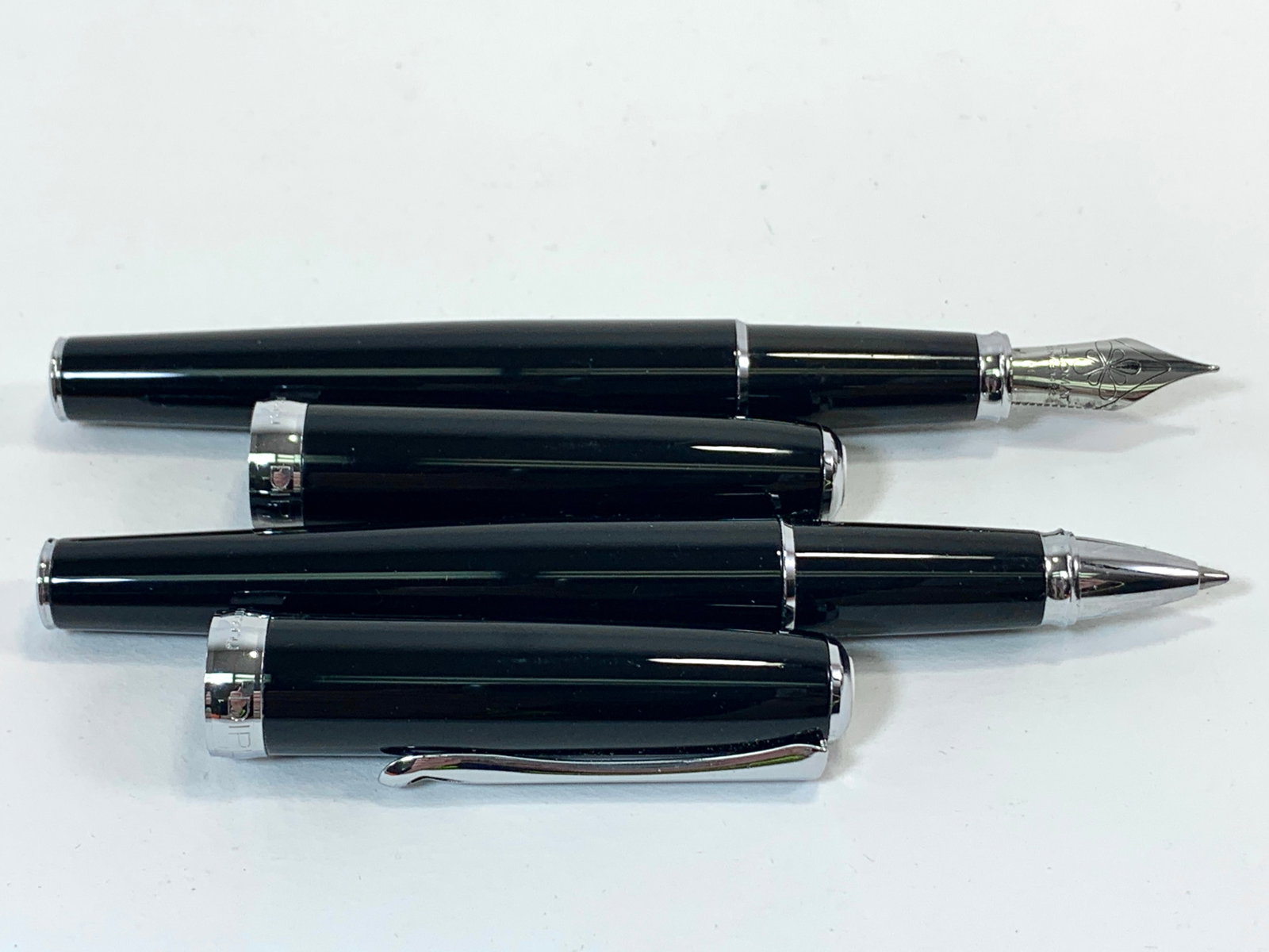 Diplomat Germany Black Enamel and Chrome Fountain and Ballpoint Pen Set: Excellent light use condition, the fountain pen top stays in the cap sometimes. Approx. 5 1/2". Fine original finish throughout. No box. Shipping: We do not provide in-house shipping or packing. Pleas