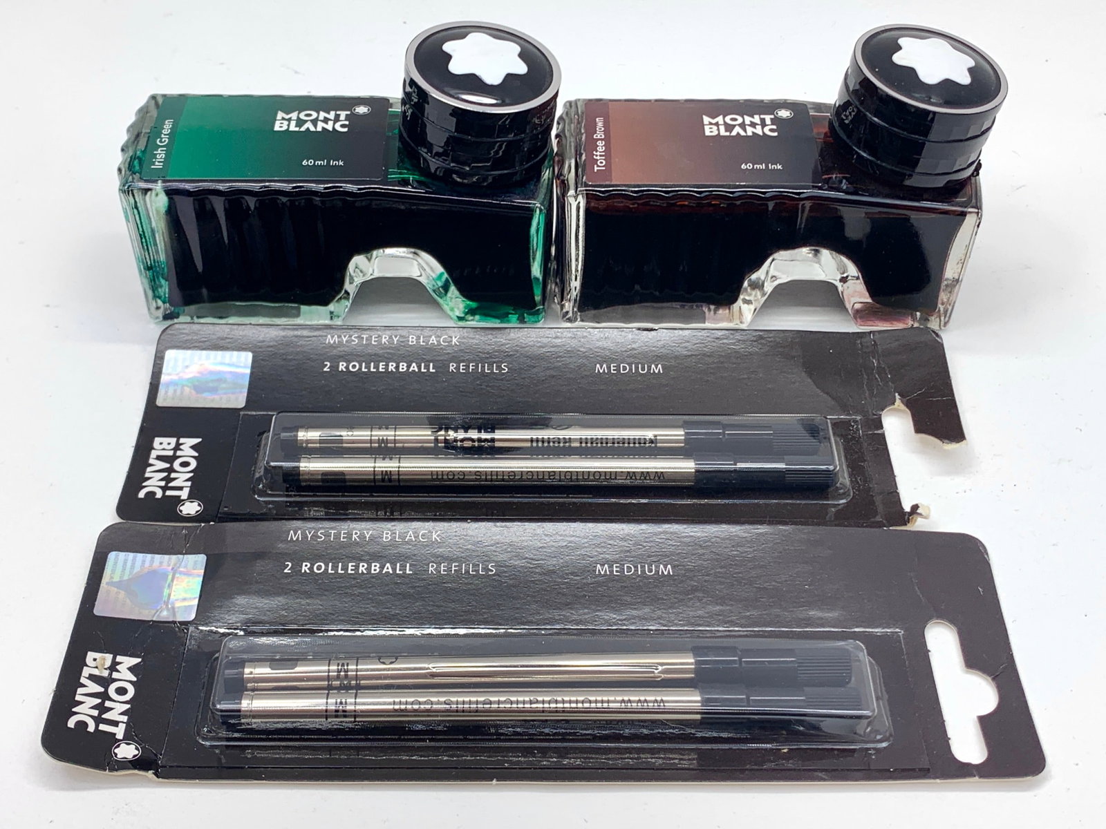 Mont Blanc Irish Green & Toffee Brown Ink With Mystery Black Rollerball Refills: 60 ml of each color; four refills. Shipping: We do not provide in-house shipping or packing. Please reach out to one of our preferred shippers for a quote: Donald Camden UPS Store #4608 store4608@theu