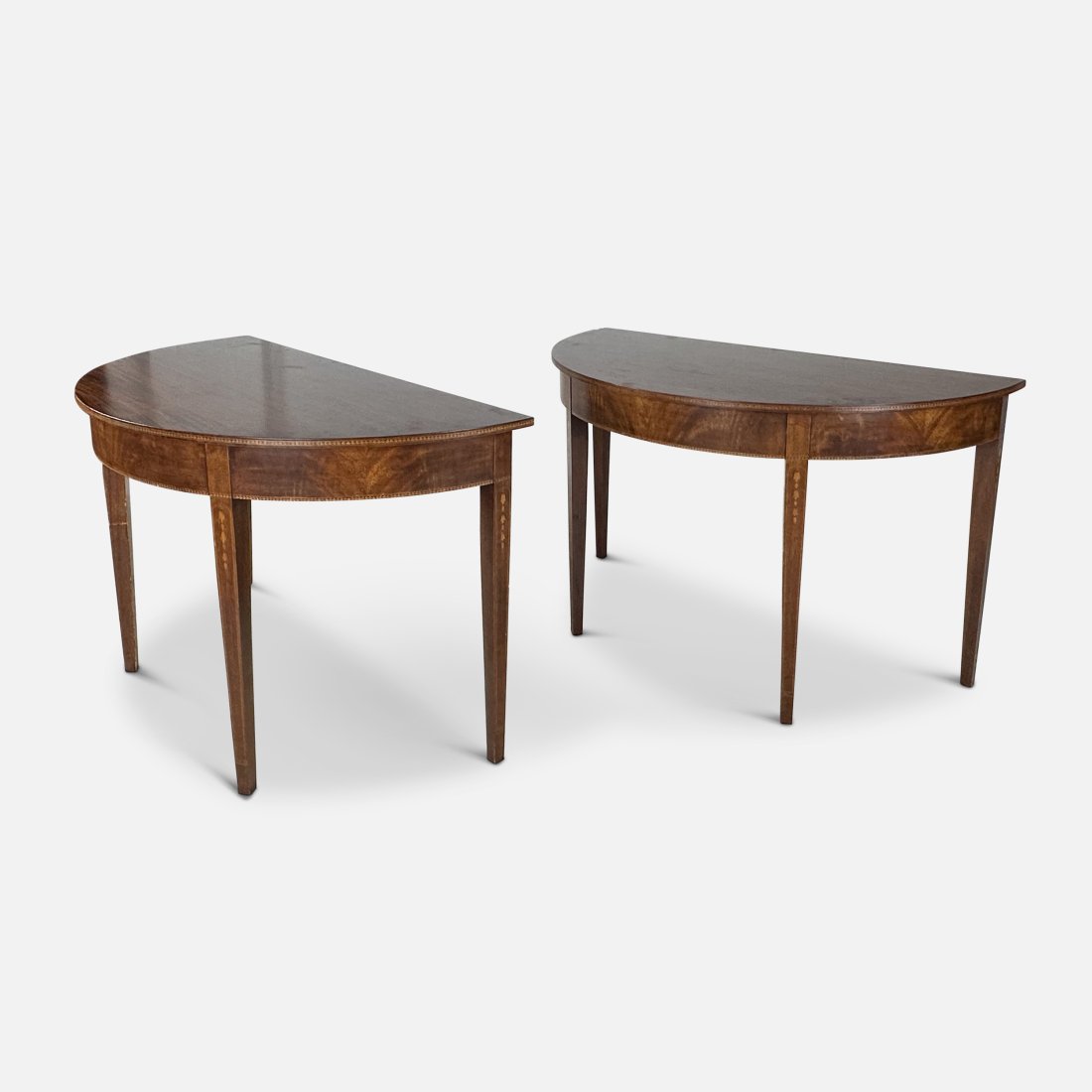 Matched Pair Antique English Inlaid Mahogany Demilune Console Tables: Matched Pair Antique English Inlaid Mahogany Demilune Console Tables. Ca. early 20thC. Very good with no apparent breaks or repairs. Measurements included in listing for one of the tables. We Do Not P