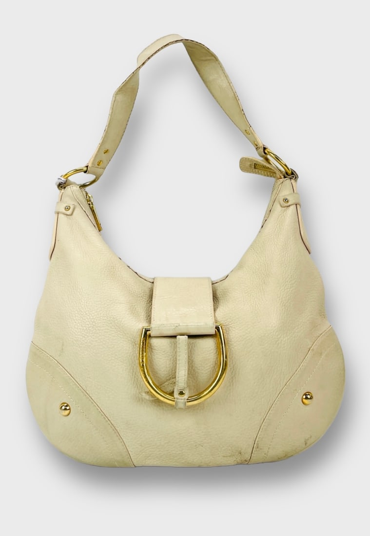 DOLCE & GABBANA Ivory Leather Hobo-style Bag with Goldtone Hardware: Preowned, condition fair wear, some stains and scratches on exterior Shipping: We do not provide in-house shipping or packing. Please reach out to one of our preferred shippers for a quote: Donald Cam