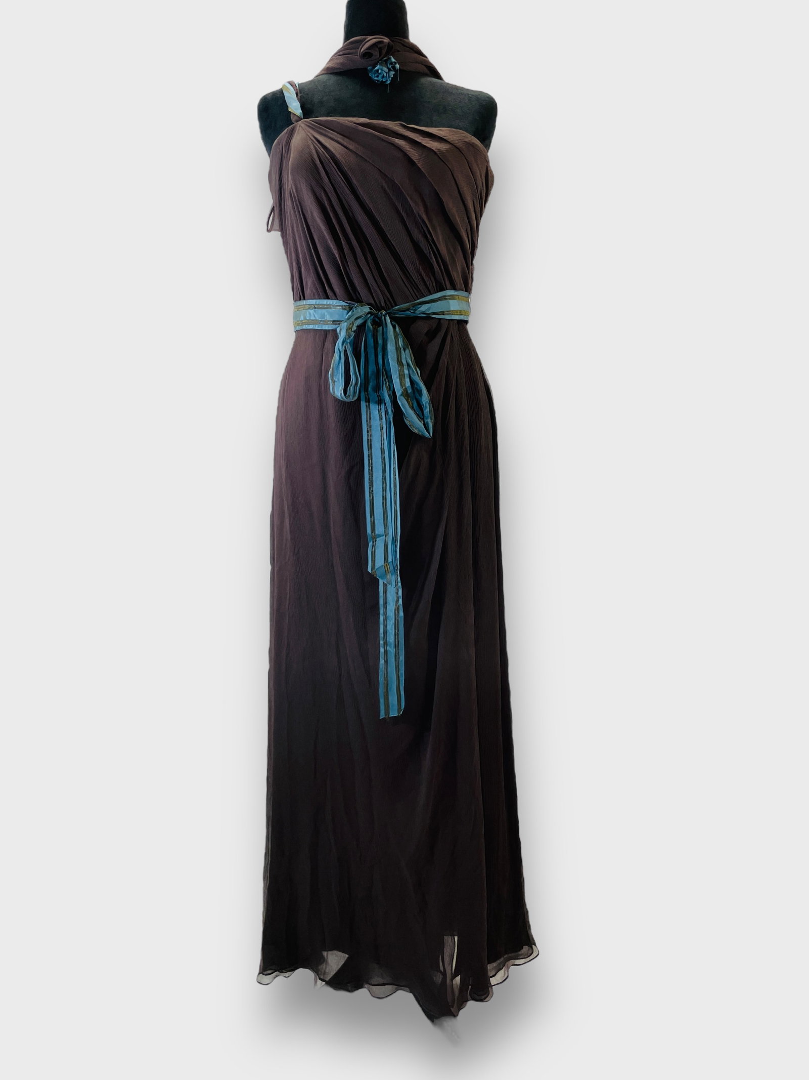 CAROLINA HERRERA NEW YORK, Dark Taupe Chiffon One Shoulder Evening Gown with Neck Scarf Detail. Sz: Small flaw to bow. See pics. Shipping: We do not provide in-house shipping or packing. Please reach out to one of our preferred shippers for a quote: Donald Camden UPS Store #4608 store4608@theupsstor