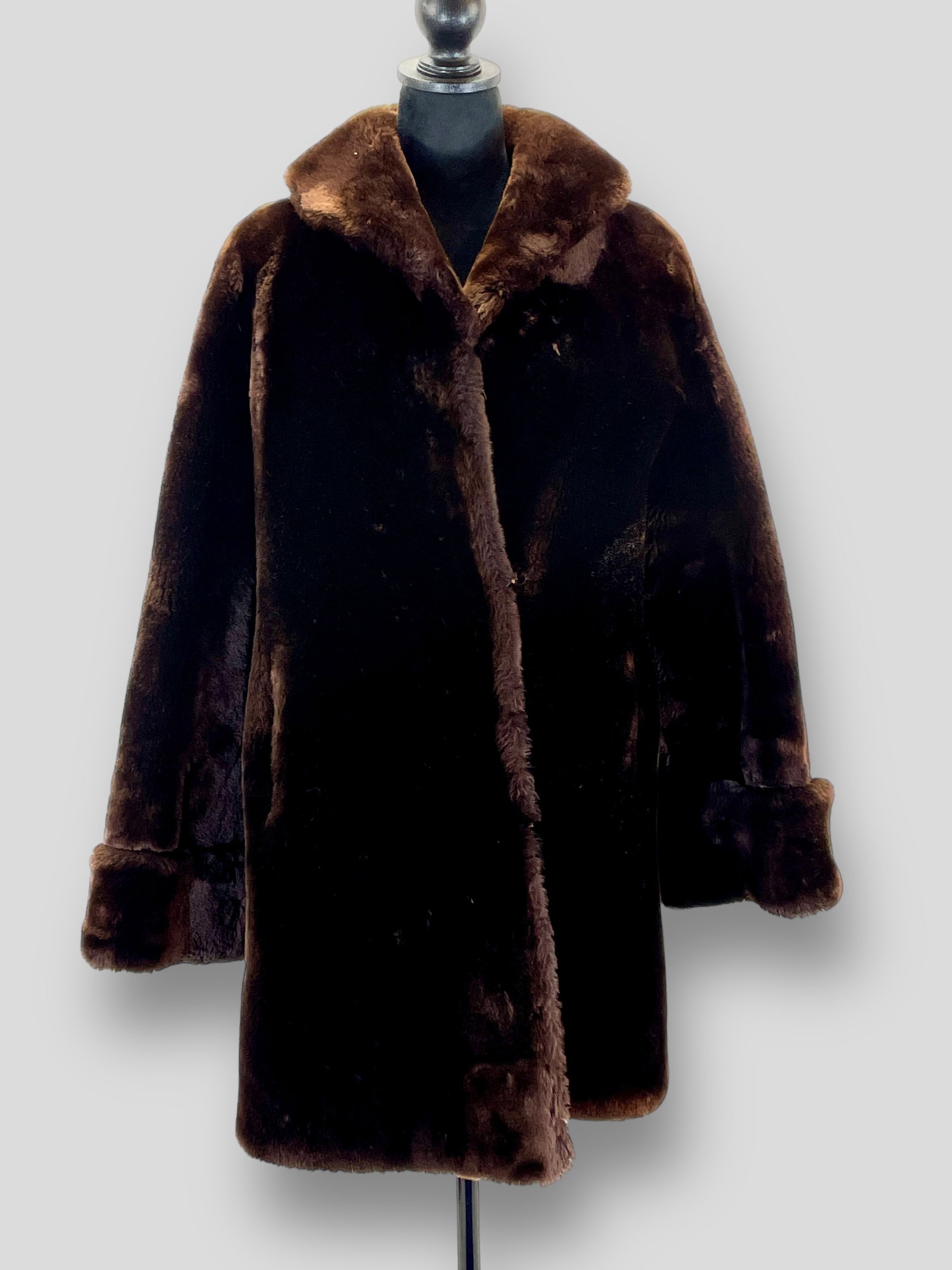 Vintage Chocolate Mouton Fur Coat: Measurements taken flat. Shoulders 25" Chest 18" Length 29" Shipping: We do not provide in-house shipping or packing. Please reach out to one of our preferred shippers for a quote: Donald Camden UPS S