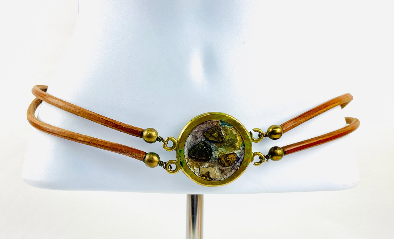 Vintage Bohemian Belt. Made of Leather Cord and Brass with Talisman. 31?? long: Good Condition; Patina from age. Shipping: We do not provide in-house shipping or packing. Please reach out to one of our preferred shippers for a quote: Donald Camden UPS Store #4608 store4608@theups