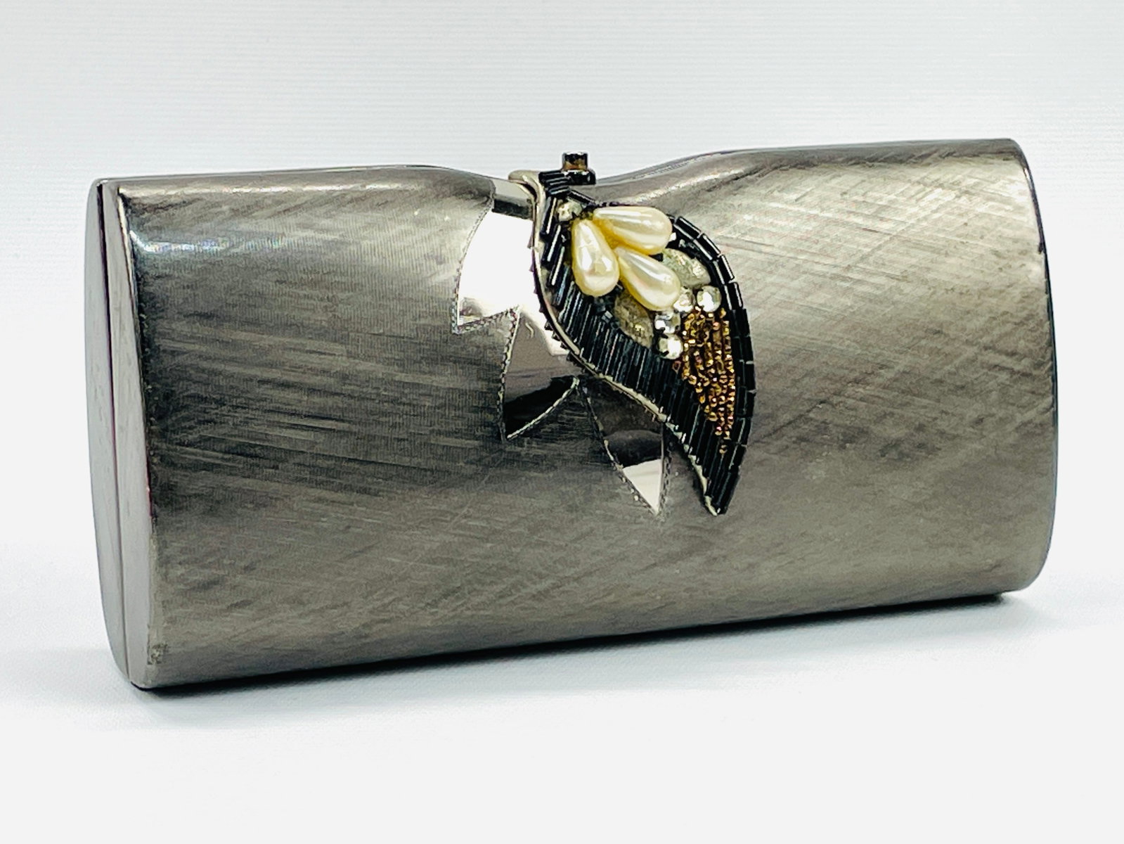 RODO Brushed Metal Silver Clutch with Pearl, Rhinestone and Beaded Detail: Preowned, good condition Shipping: We do not provide in-house shipping or packing. Please reach out to one of our preferred shippers for a quote: Donald Camden UPS Store #4608 store4608@theupsstore.co