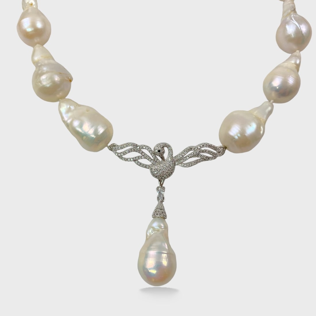 Baroque Pearl Silver Tone Prong Set Rhinestone Swan Necklace 21: Approx. 2 1/4” drop.