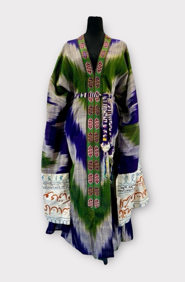 Bohemian Silk Ikat and Cotton Caftan with Arabic Embroidery on Dramatic Sleeves. In Royal Blue with: Spots on Cotton Sleeve Cuffs. Measurement taken Flat. Chest 37 in. Length 53 in.