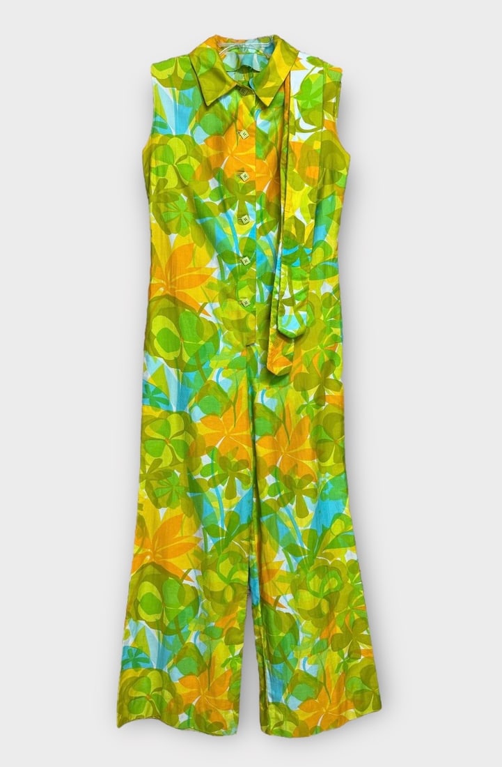 Vintage Hippie Mod Flare Leg Jumpsuit with Neck Scarf. Yellows, Green, and Hint of Blue with Square: Wear to back bottom hemline and snag at armpit. Measurement taken flat. Chest 18 in. Waist 16 in. Length 59 in.