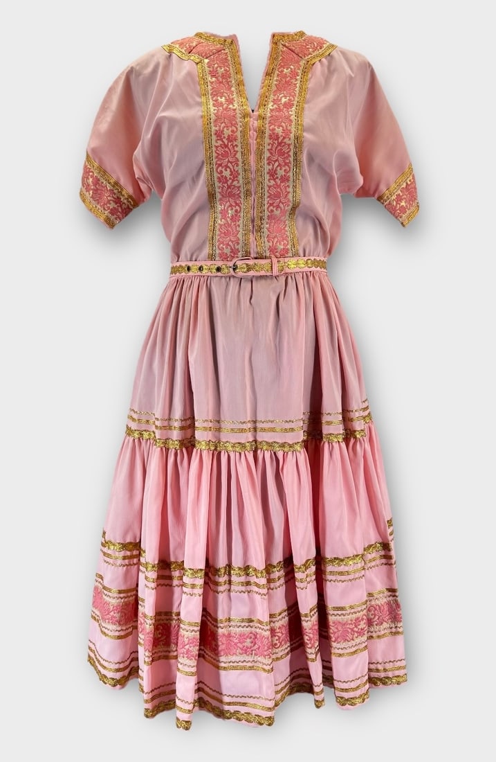 Vintage FAYE CREATIONS “Patio Fashions?? Vintage Pale Pink Fit Metalic and Gold Trim. Short: Some dirt at neckline. 2 spots on back shoulder and at waistline. Measurement taken flat. Shoulders 15 in. Chest 16 in. Waist up to 15 in.