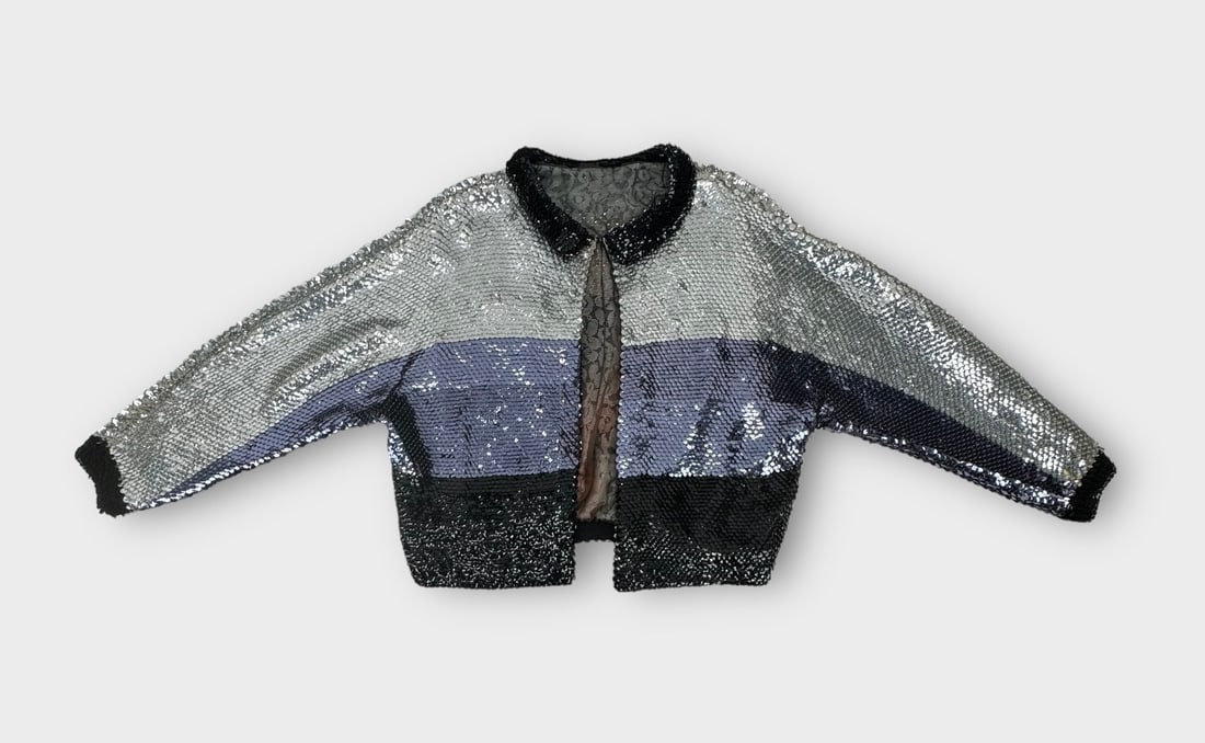 Vintage Disco Baby Stretch Knit Sequin Cardigan. Silver/Purple/Black Colorblock, Fully Lined. No: Good Condition. Measurement taken flat. Shoulders 15 in. Chest 21 in.