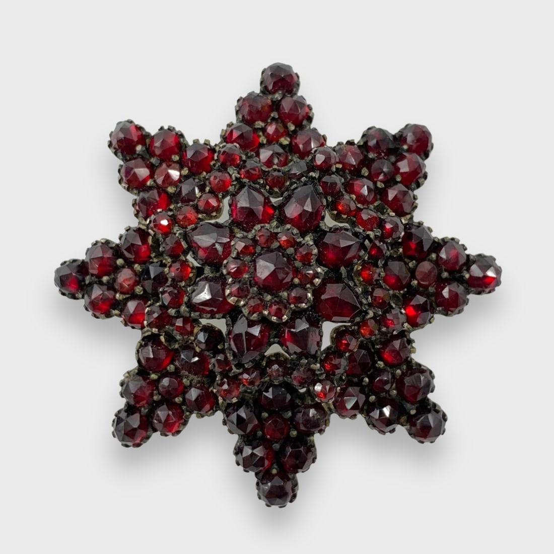 Vintage Gilt Silver Bohemian Garnet Brooch: Weighs approx. 8.7 grams. Approx. 1 5/8” x 3/4”. Good preowned condition. No missing stones.