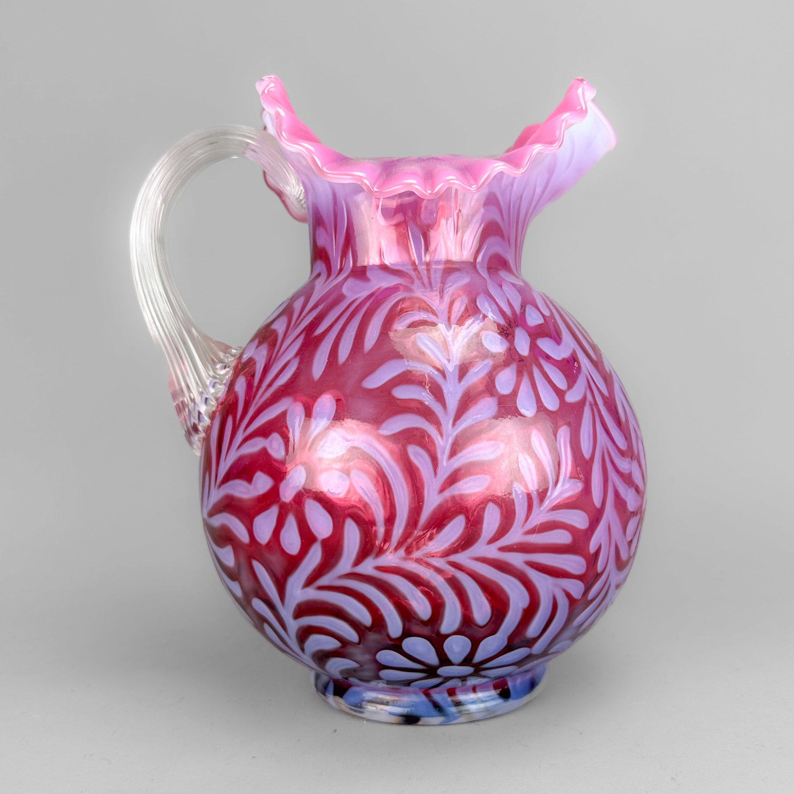 Fenton Vine and Daisey Art Glass Water Pitcher: Ca. second half 20thC. Approx. 9 1/8" tall. Excellent, with no chips, cracks, scratches or repairs. No stains, no interior residue. Originally designed by Northwood, LG Wright commissioned Fenton to p