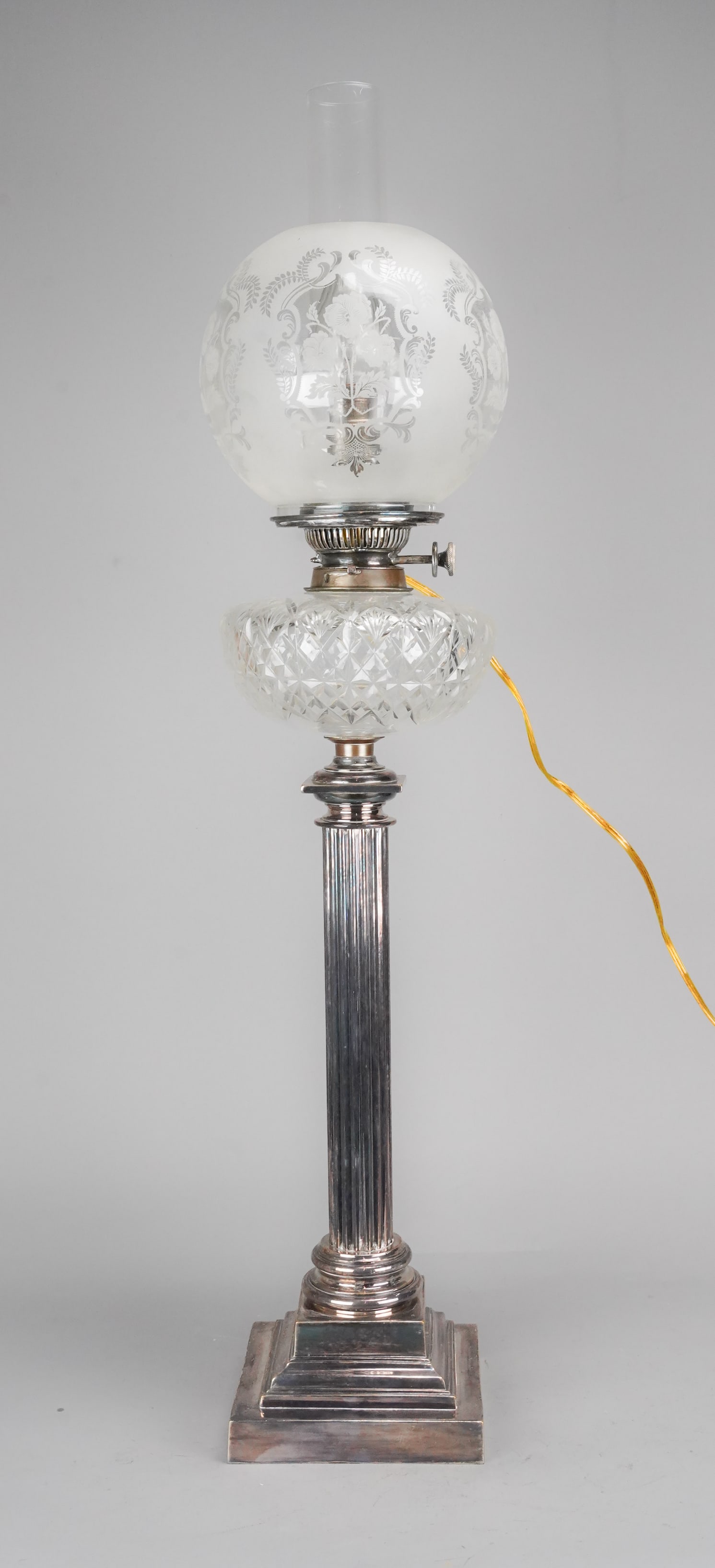 Antique English Silverplate Corinthian Column and Cut Glass Banquet Lamp: Ca. first quarter 20thC. Excellent with no bends, breaks or repairs. J Hinks & Sons had a foundry in Birmingham from 1835 and were responsible for the vast improvements to oil lamps, patenting the dup