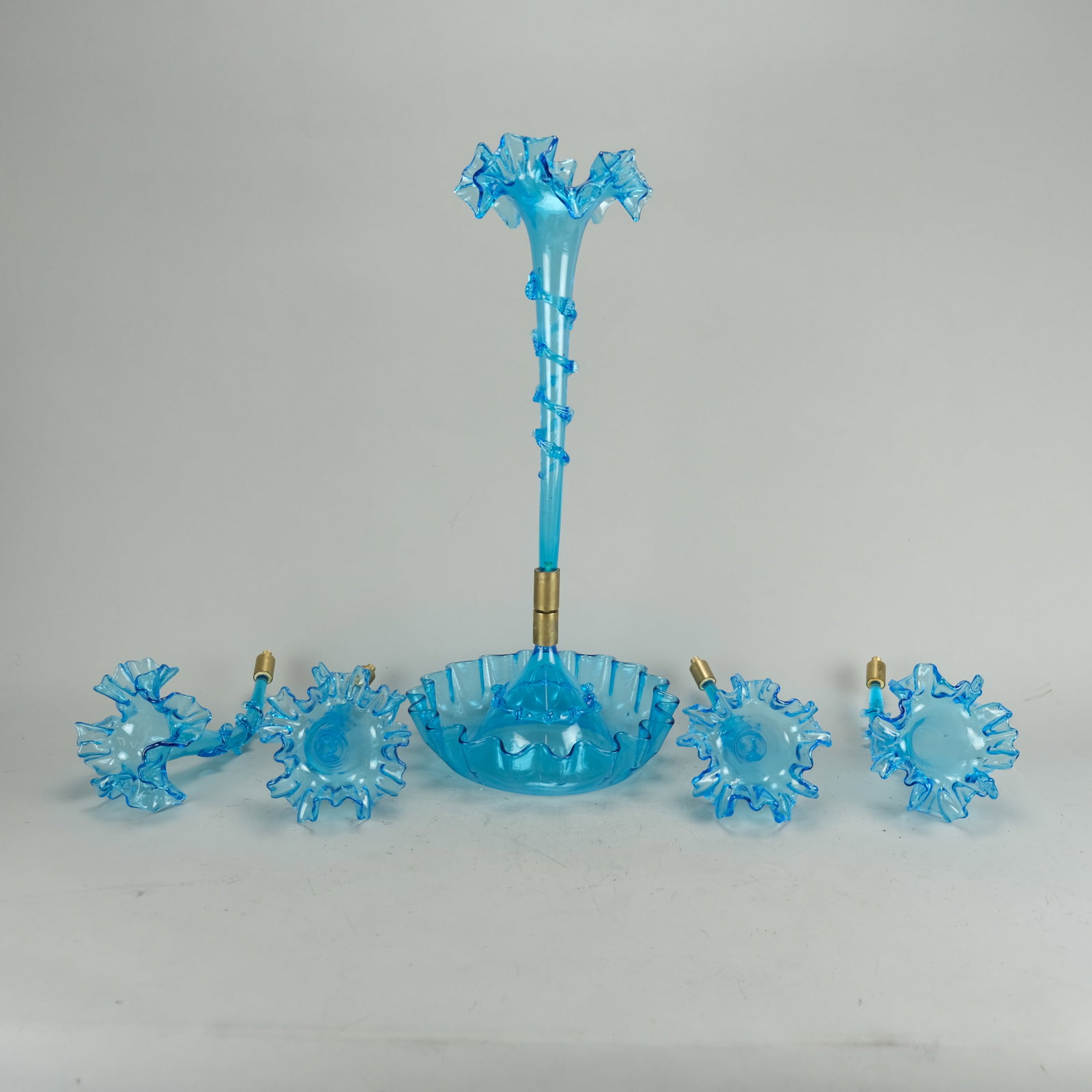 Antique Victorian Blue Art Glass and Brass Five Trumpet Epergne-Needs Fitter: Ca. last quarter 19th to first quarter 20thC. Excellent as found with no chips, cracks or repairs. As it stands now, it is a single trumpet epergne with extra trumpets. What is needed to create the fu