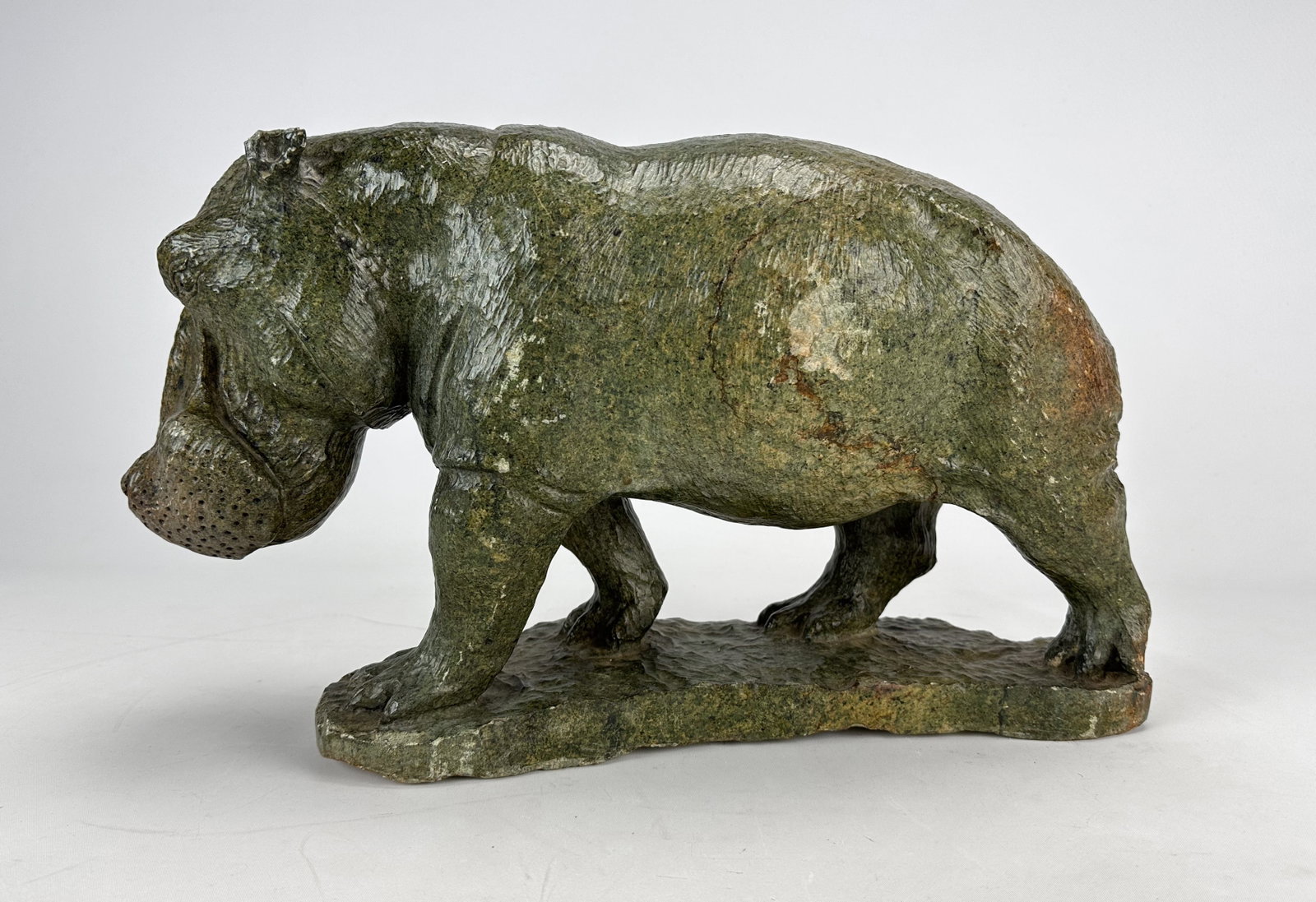 Rugare Robin Kutinyu Carved Serpentine Hippotomus Sculpture African Animal Statue: Ca. last half 20thC. Good as shown, shows cracks (see pics), light chips, with carving marks seen throughout. Sculpted by Robin Kutinyu, a Zimbabwean artist b.1976. He has private collectors in the US