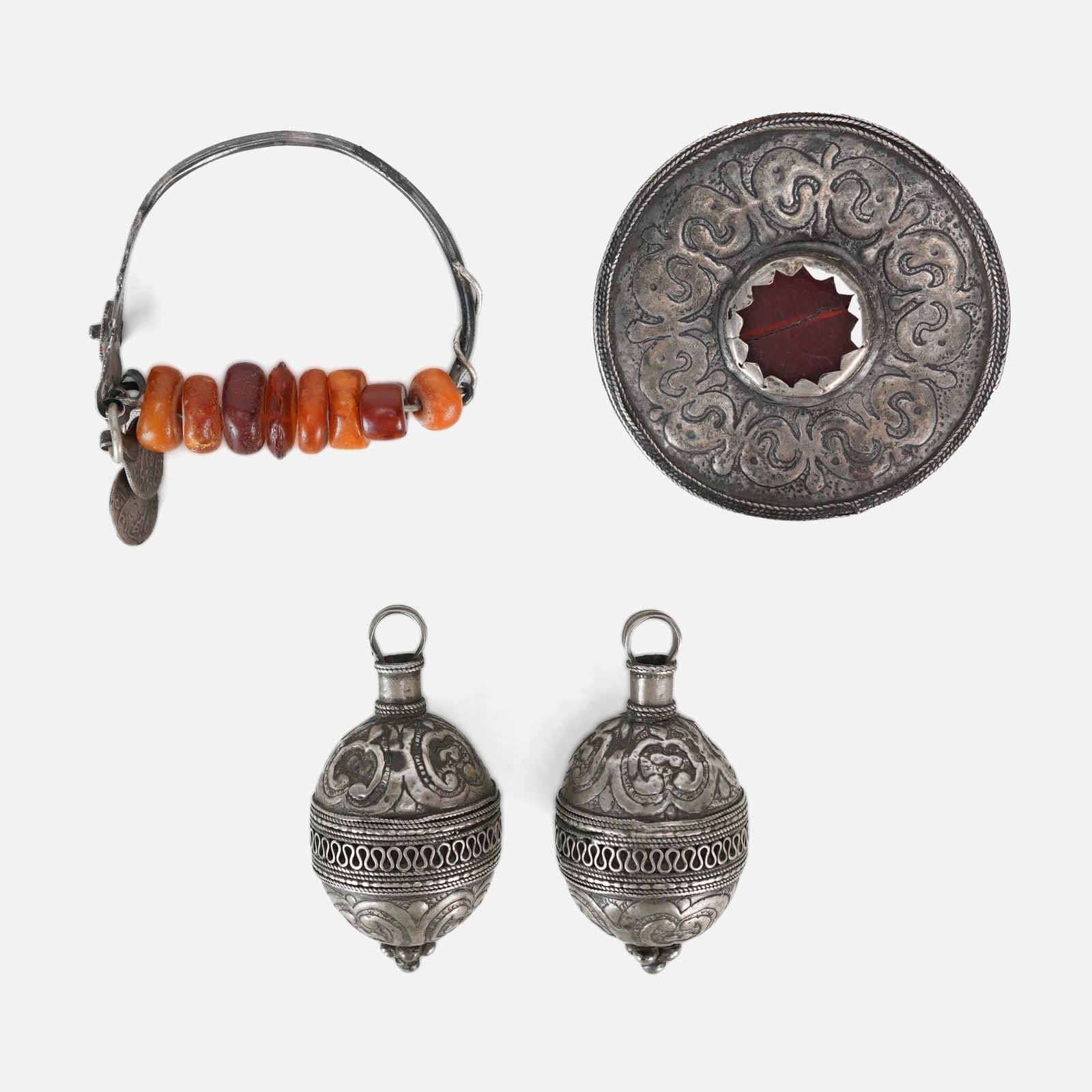 Central Asian Karakalpak Tribal Silver Jewelry Decorations: Central Asian Karakalpak Tribal Silver Jewelry Decorations. Ayshiq measures approx. 2 3/4" x 2 3/4". Jumalaq tu'yme measure approx. 2 1/2" x 1 1/4". Band measures approx. 2 1/2" x 2 1/4". Amber measur