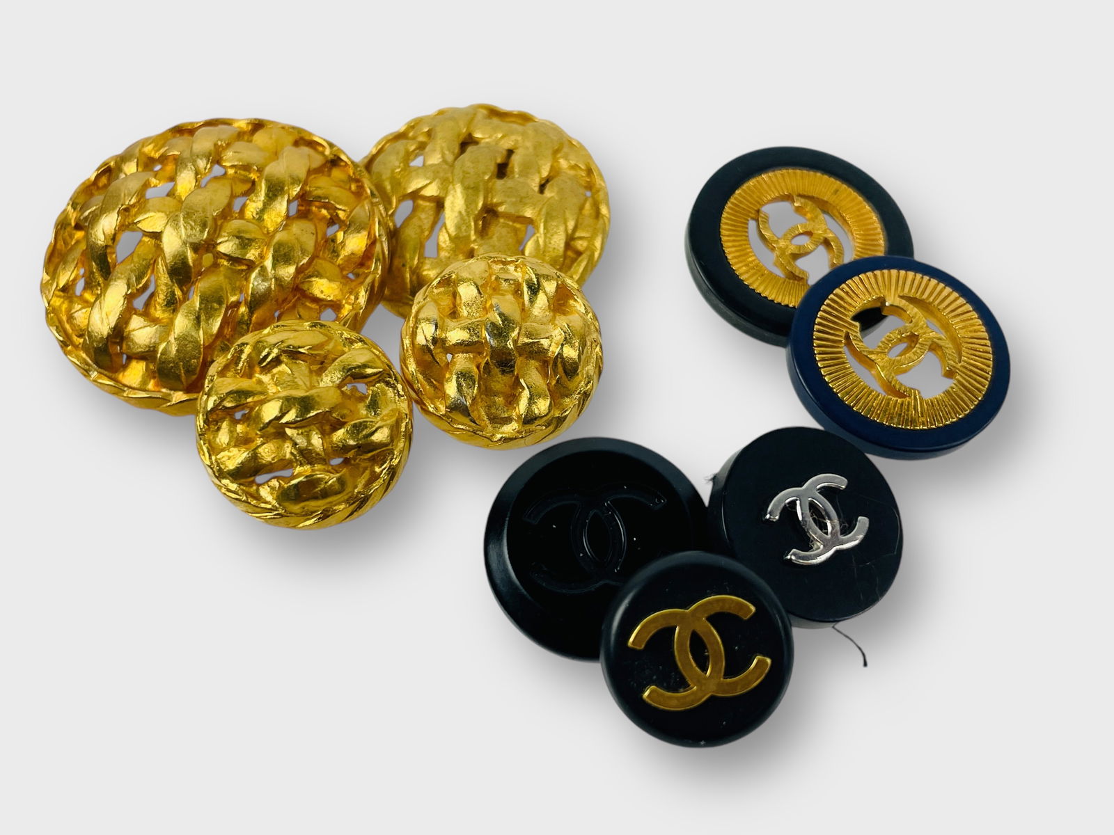 CHANEL Collection of 9 Buttons, Goldtone and Black: Preowned, sold as is.