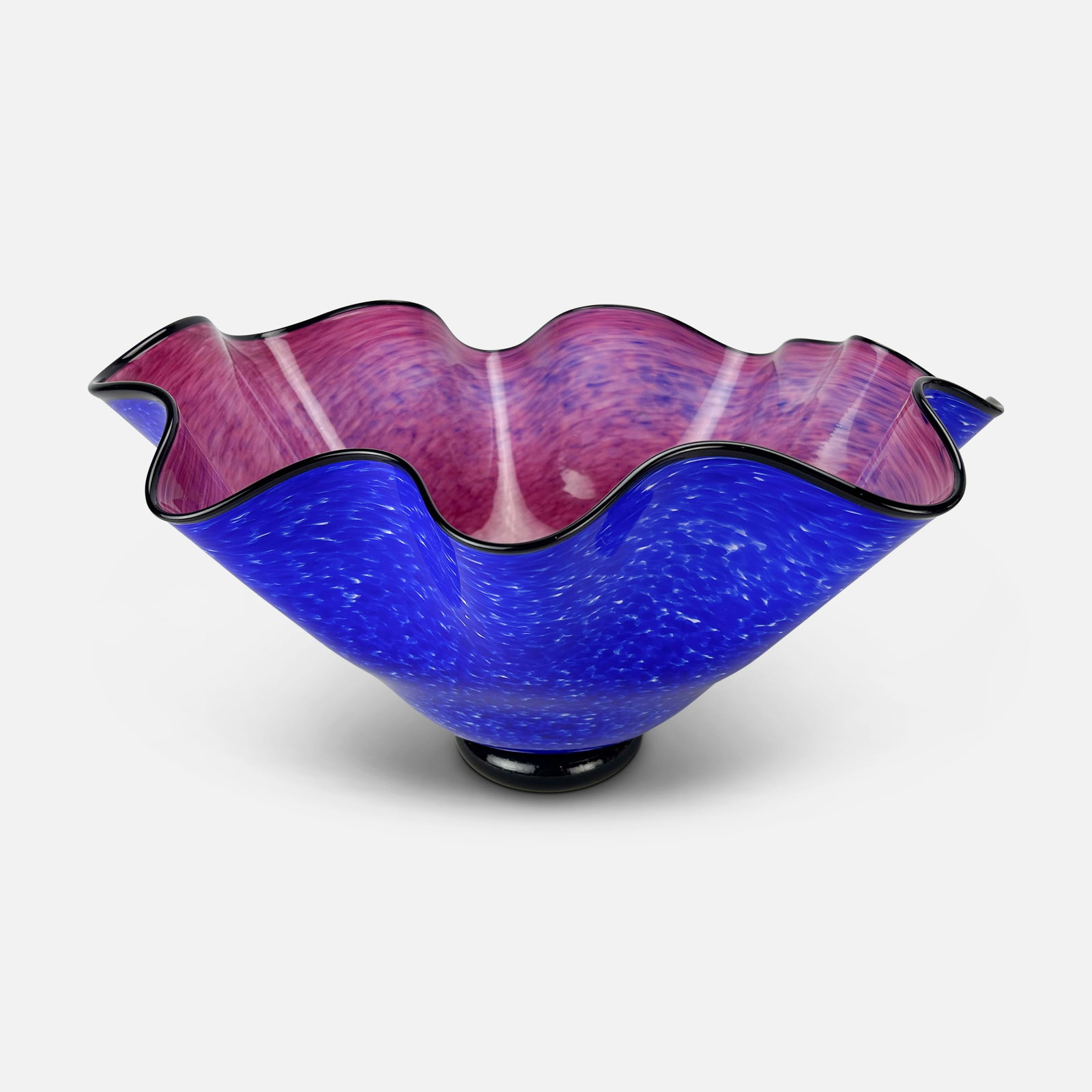 Large and Striking Ruffled Rim Art Glass Blue & Magenta Centerpiece Bowl: Ca. last quarter 20thC. Excellent with no chips or cracks. Large vintage ruffled rim handkerchief art glass bowl. Apparently not marked or signed. We do not provide in-house shipping! Please reach out