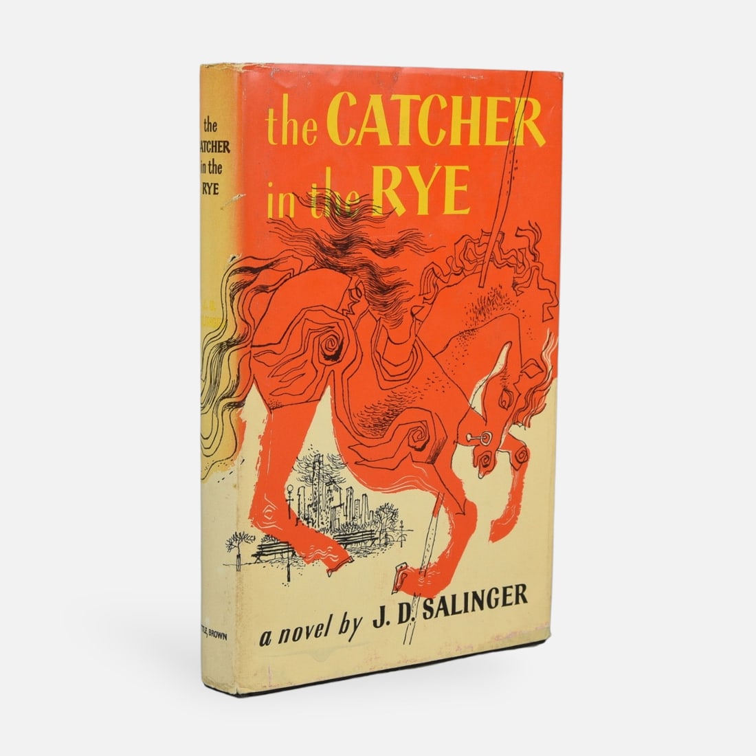 Catcher In The Rye, Salinger, J.D. Book Club Edition 1951: Catcher In The Rye by J. D. Salinger. Boston: Little Brown and Company, 1951. Book Club Edition. Black cloth, spine lettered in gilt, pictorial jacket. Jacket spine sunned, paper loss to the rear pane