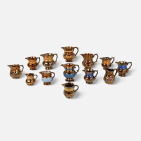 Thirteen Antique Staffordshire Copper Luster Pitchers