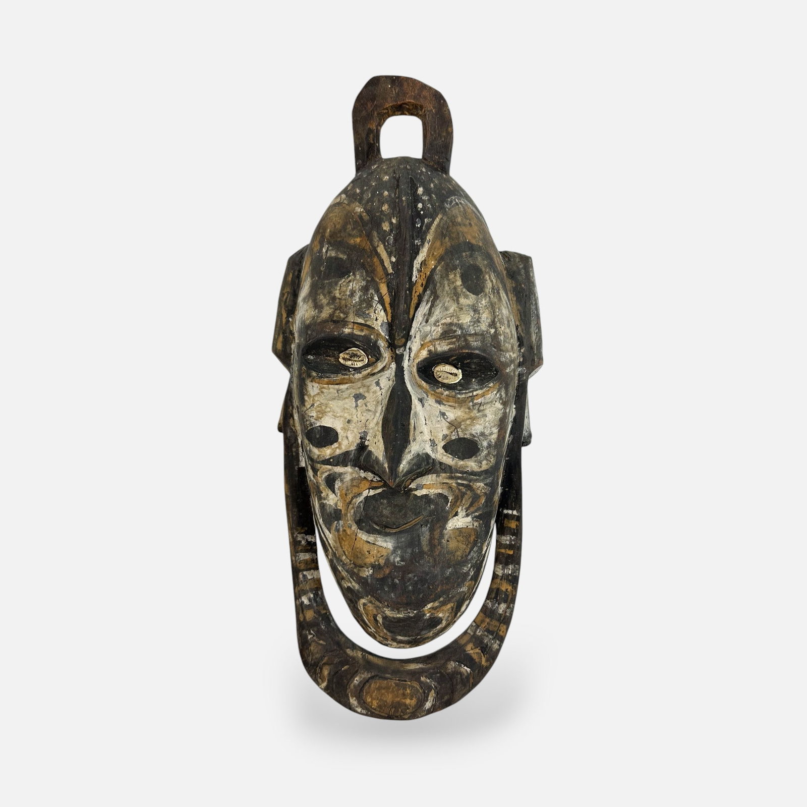 Tribal Papua New Guinea Sepik River Carved and Painted Wood Wall Hanging Mask-Form Sculpture: Good age-appropriate condition with shown minor surface age-cracks, split to tip of ring on top of head.