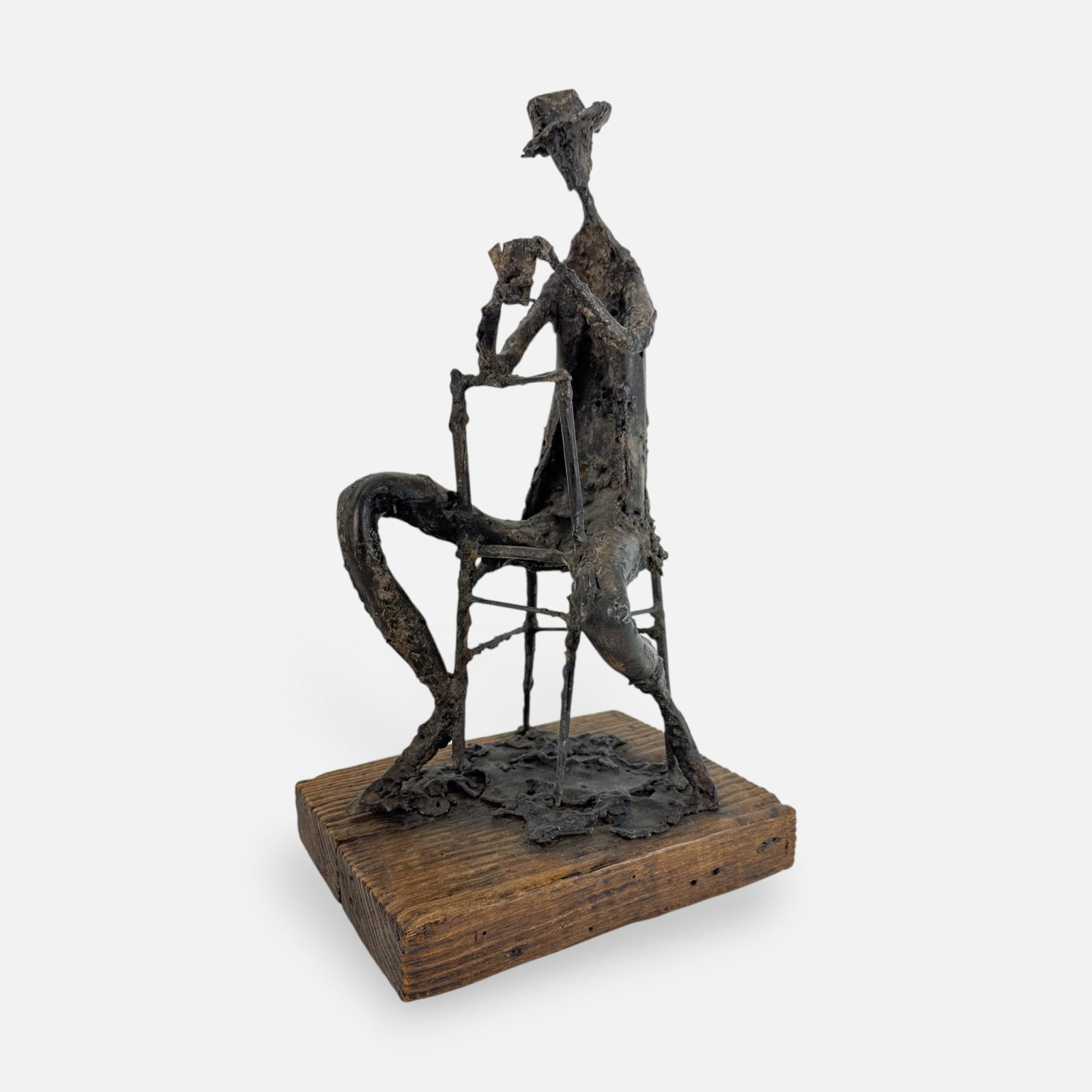 Robert Edward Kuhn "Card Player" Signed Contemporary Bronze Sculpture Group: Ca. second half 20thC. Very good as shown with no breaks, splits or repairs. Signed "Robert E. Kuhn" in white on plank, additionally, signed and titled "Card Player" on base.