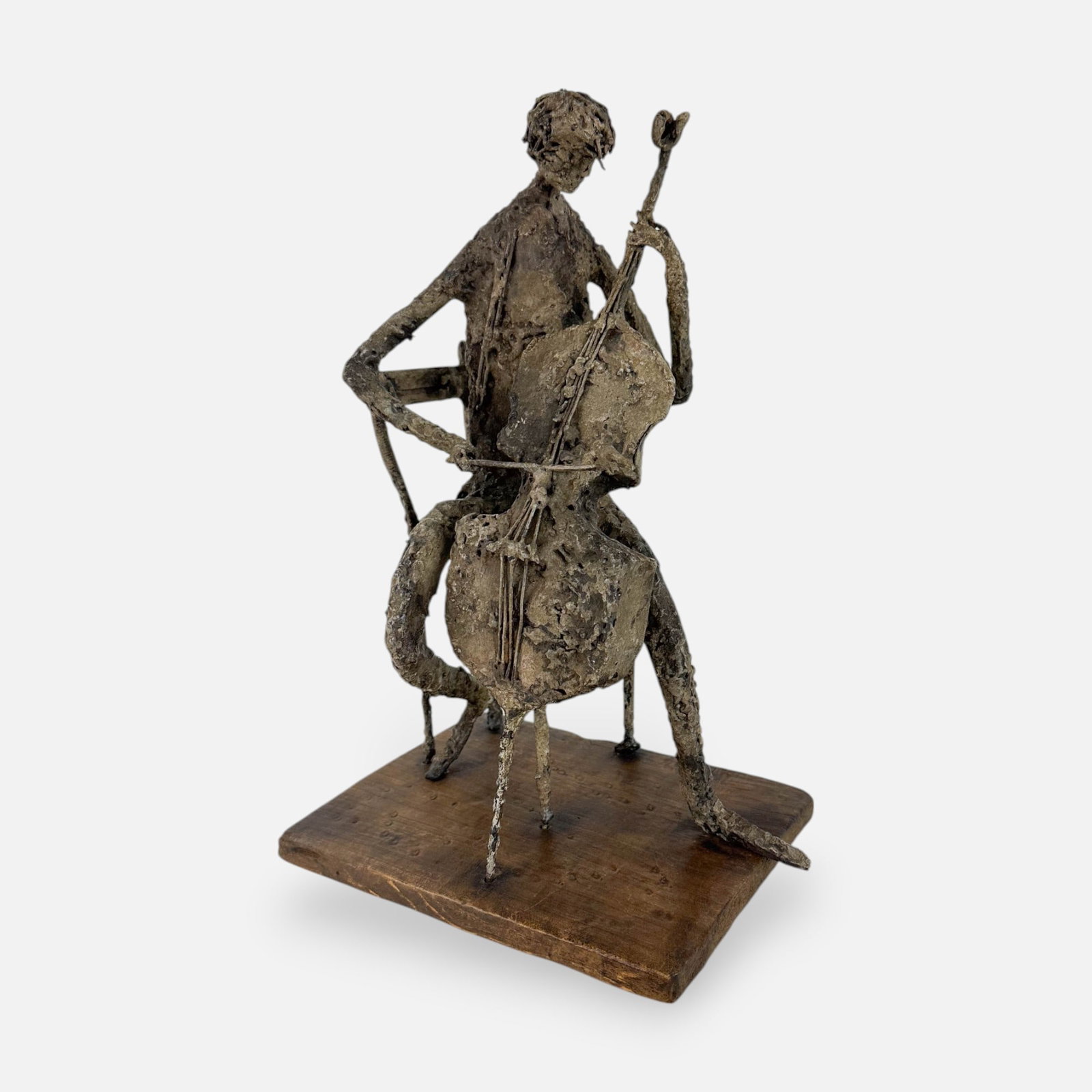 Robert Edward Kuhn "Cello Player" Signed Contemporary Bronze Sculpture Group: Ca. last half 20thC. Very good as shown with no splits, breaks or repairs. Signed "Robert E. Kuhn" in white on plank.