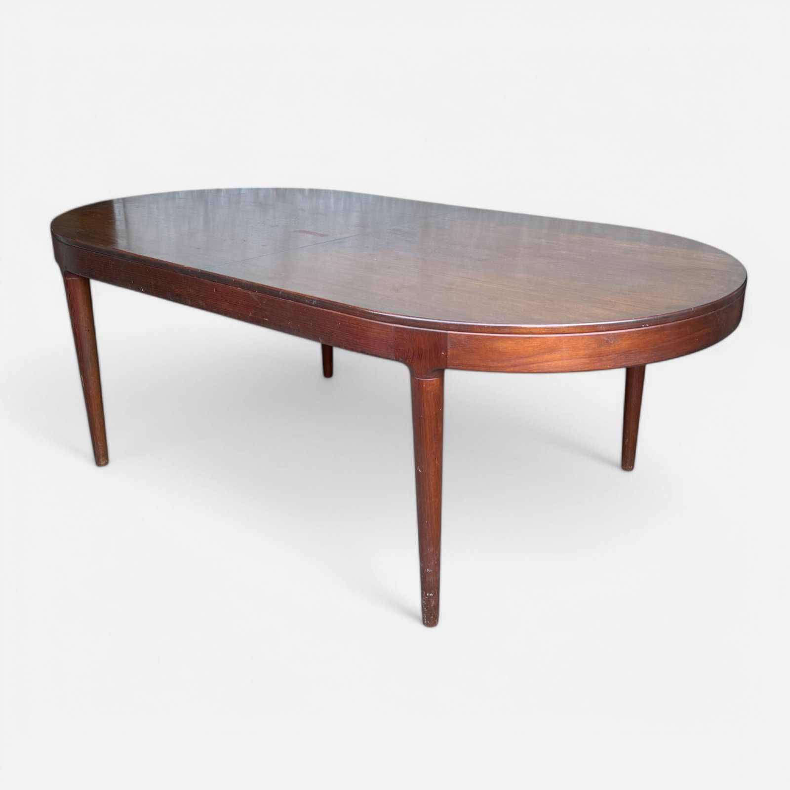 Danish Modern MCM Teak Extending Dining Table w/Two Leaves: Good overall, with age and use appropriate surface wear and discoloration. Fair discoloration to table surface. Apparently unmarked. Leaves measure approx. 19 1/2" each. Included measurements for tabl